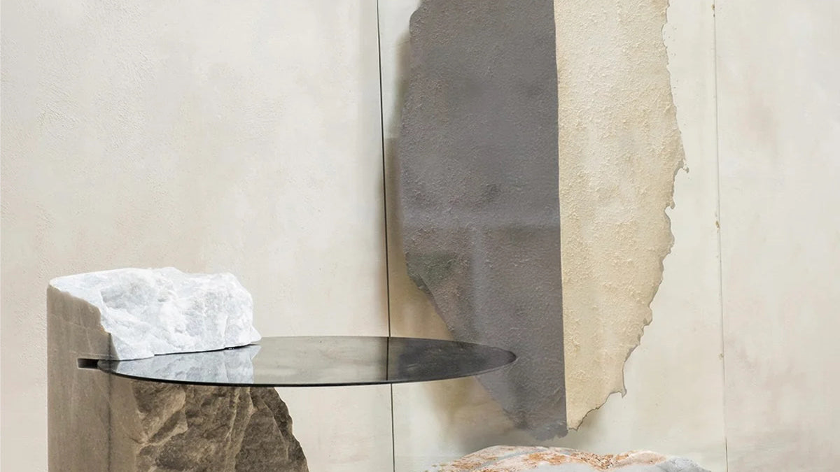 The Frutera Decorative Bowl by Emma Lindegaard Studio, featuring textural beauty, sits on a textured, ornate white pedestal against a plain white backdrop.