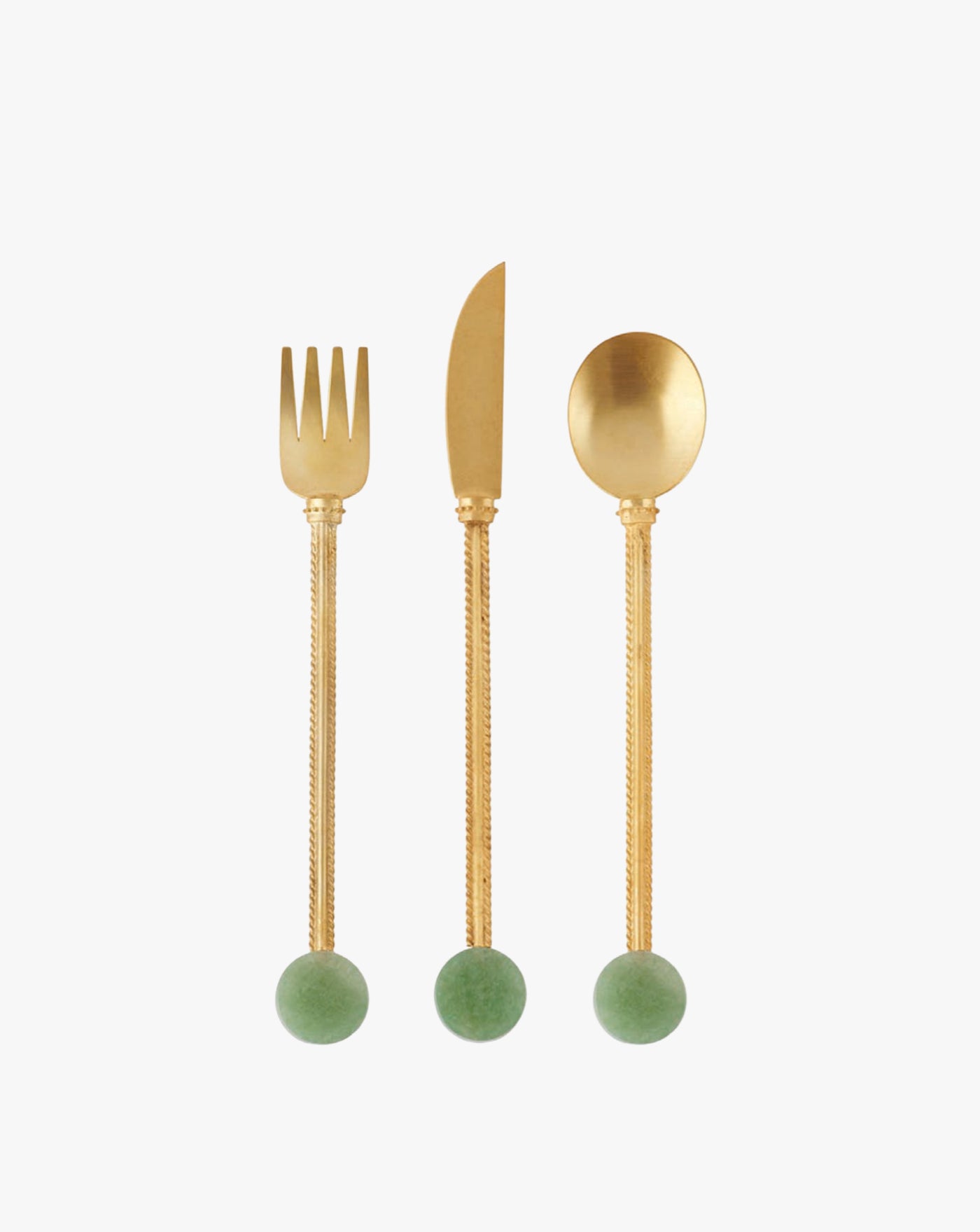 A set of elegant cutlery comprising a fork, knife, and spoon with gold-toned, textured handles ending in round green marble-like spheres. The design is minimalist and sophisticated, set against a plain white background.