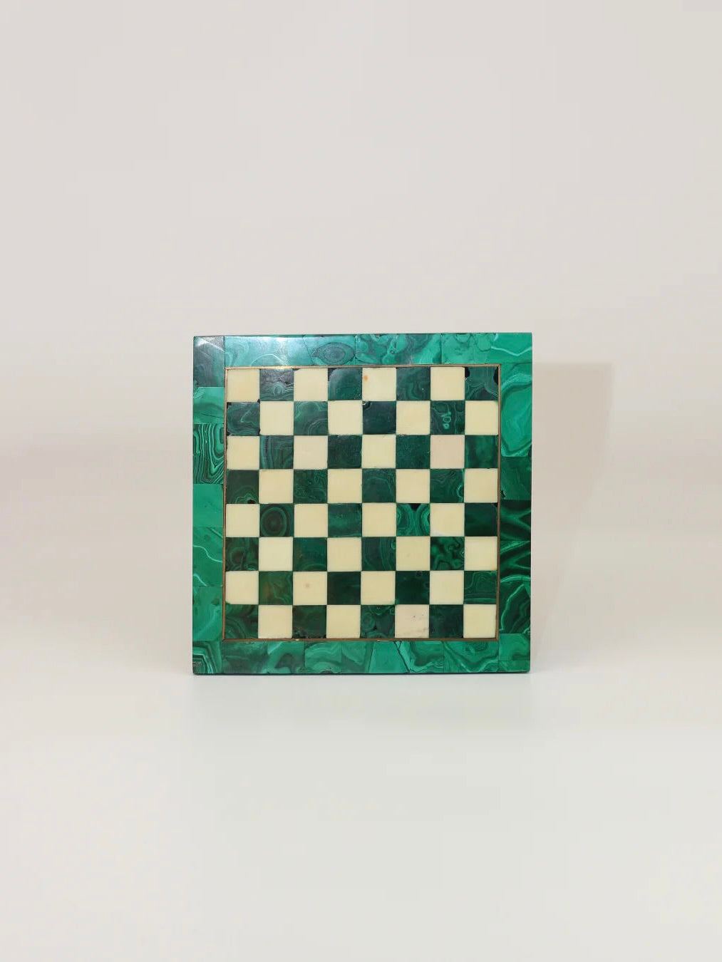 Product Description: The Malachite And Marble Chess from Boga Avante Shop features a rectangular chessboard with a green and white checkerboard pattern that evokes the charm of a vintage chess set. Its frame is adorned with a marbled green design reminiscent of malachite, and it is perfectly showcased against a plain white background to emphasize the intricate details of the board.