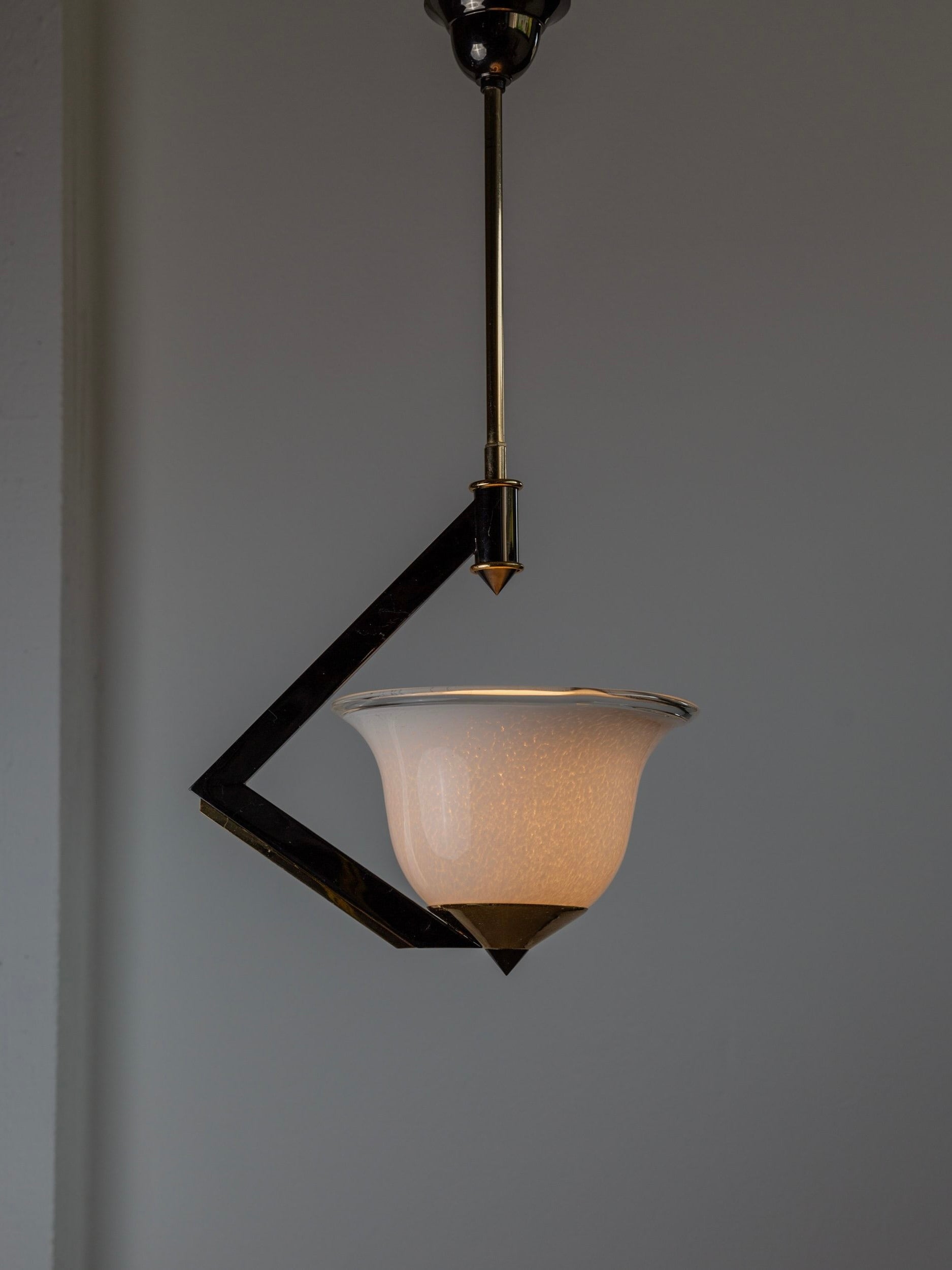 A Vintage Ceiling Lamp Murano Glass from the 1980s by Bottega Jacobs features a sleek black and gold fixture hanging against a neutral background, effortlessly blending contemporary elegance with timeless charm.