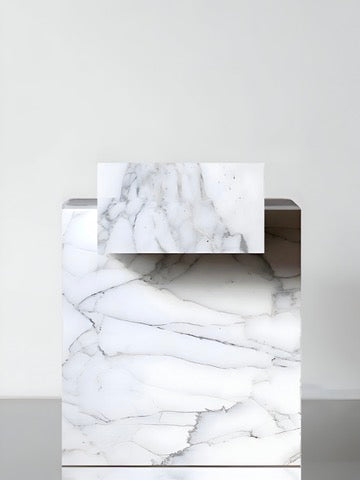 The Marbera Gaia Venato Marble Coffee Table features minimalist design with a rectangular white marble top and gray veining, balanced on a larger base and set against a plain light background.
