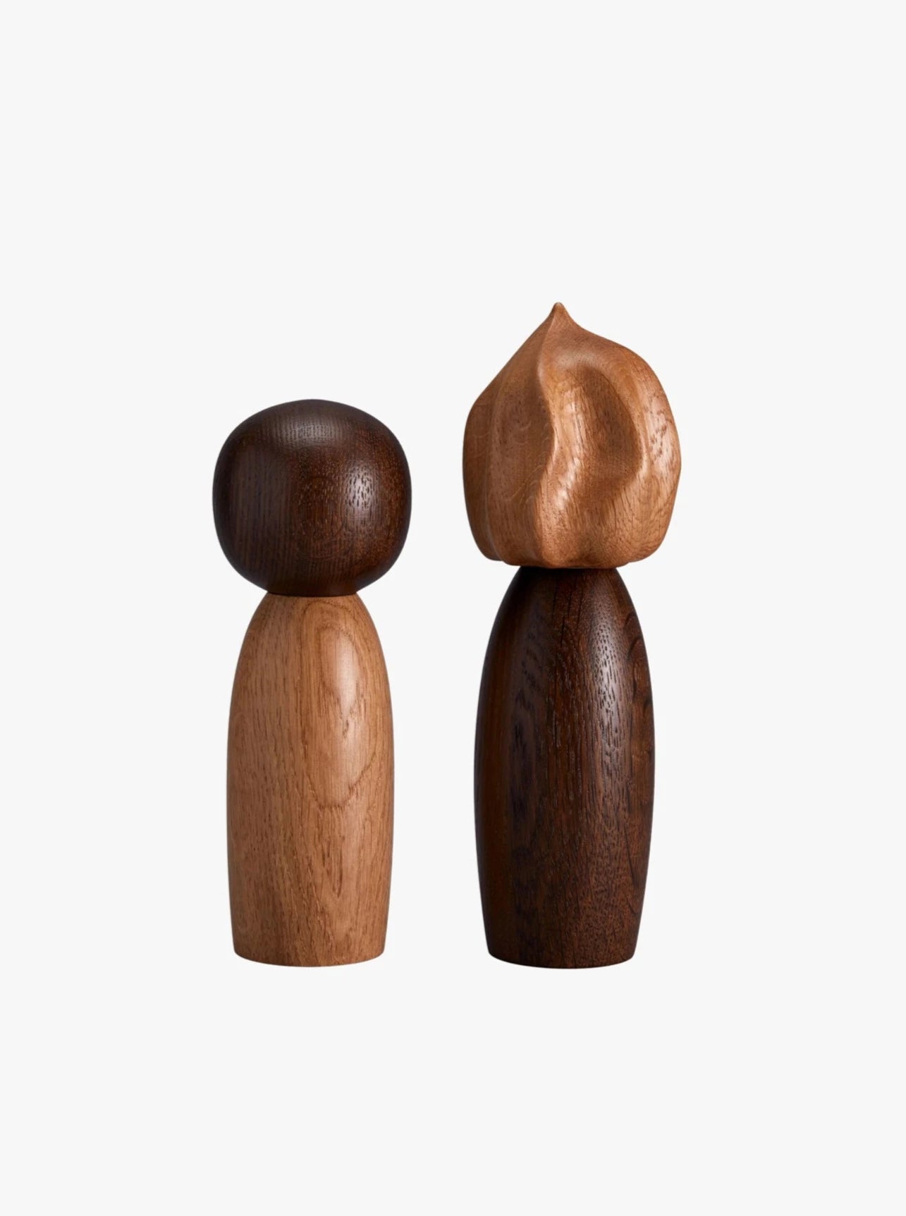 The Picanto Salt + Pepper Mills by LOBJET exude a minimalist design: one with a lighter, spherical head and the other darker with a flame-like texture. Ideal for adding contemporary flair to luxurious interiors.