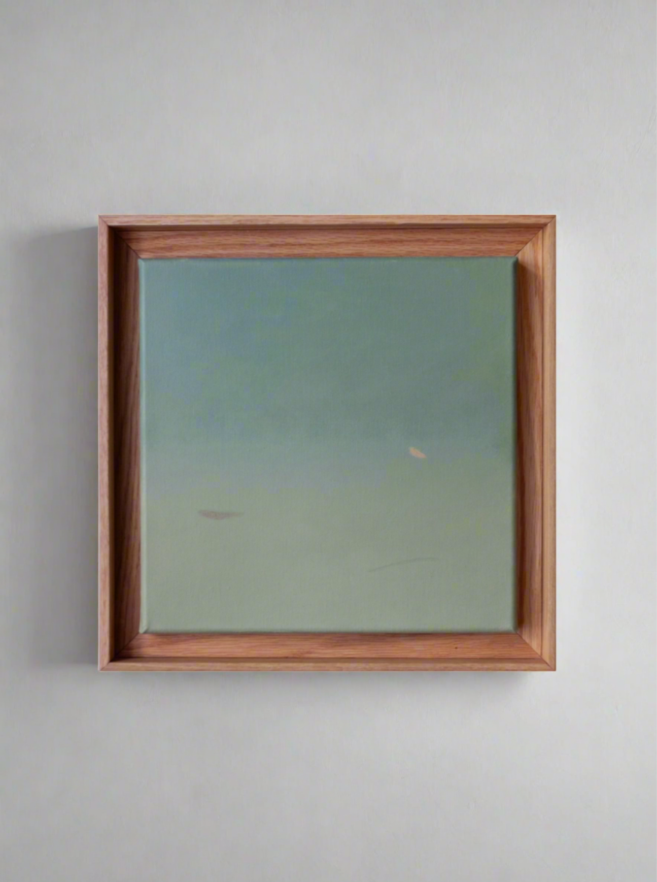 An Untitled, painting, 2024 by Rebecca von Matérn features a gradient from light to darker green, suggesting an abstract landscape or seascape. The shadow frame, made of hand-waxed oak, is simple and unadorned, emphasizing the serene and understated quality of the artwork.