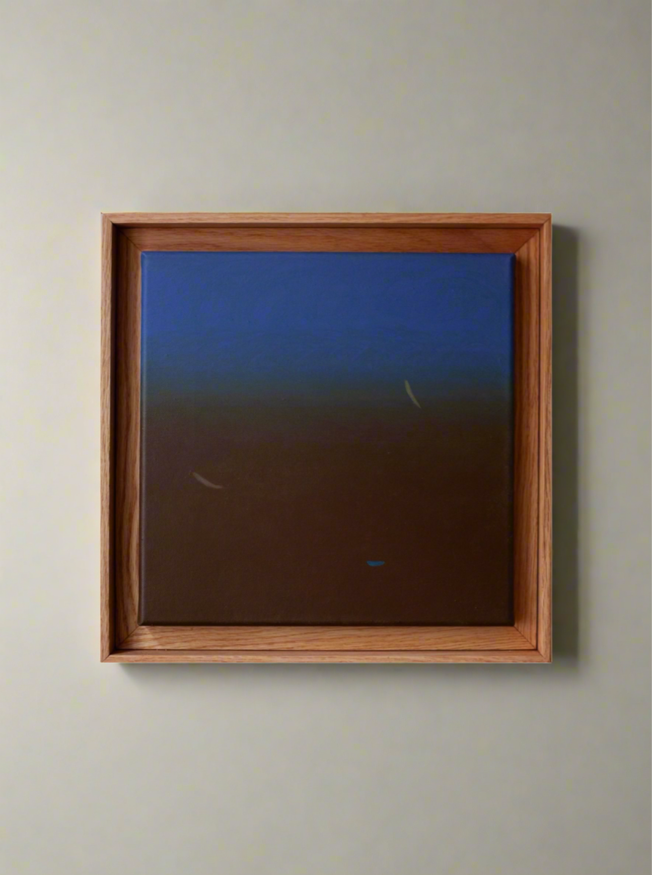 A framed painting depicting a gradual transition from dark brown to blue, with subtle, abstract fish-like shapes visible in the lower section, executed in acrylic on canvas titled "Untitled, 2024" by Rebecca von Matérn.