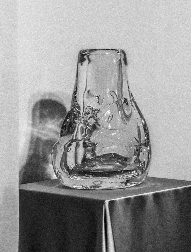 Blown glass vase with intricate blue and green swirls