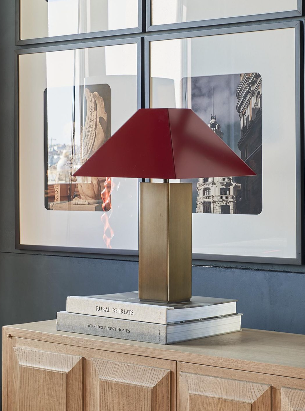 Modern black and gold Albers Lamp on wooden table in living room