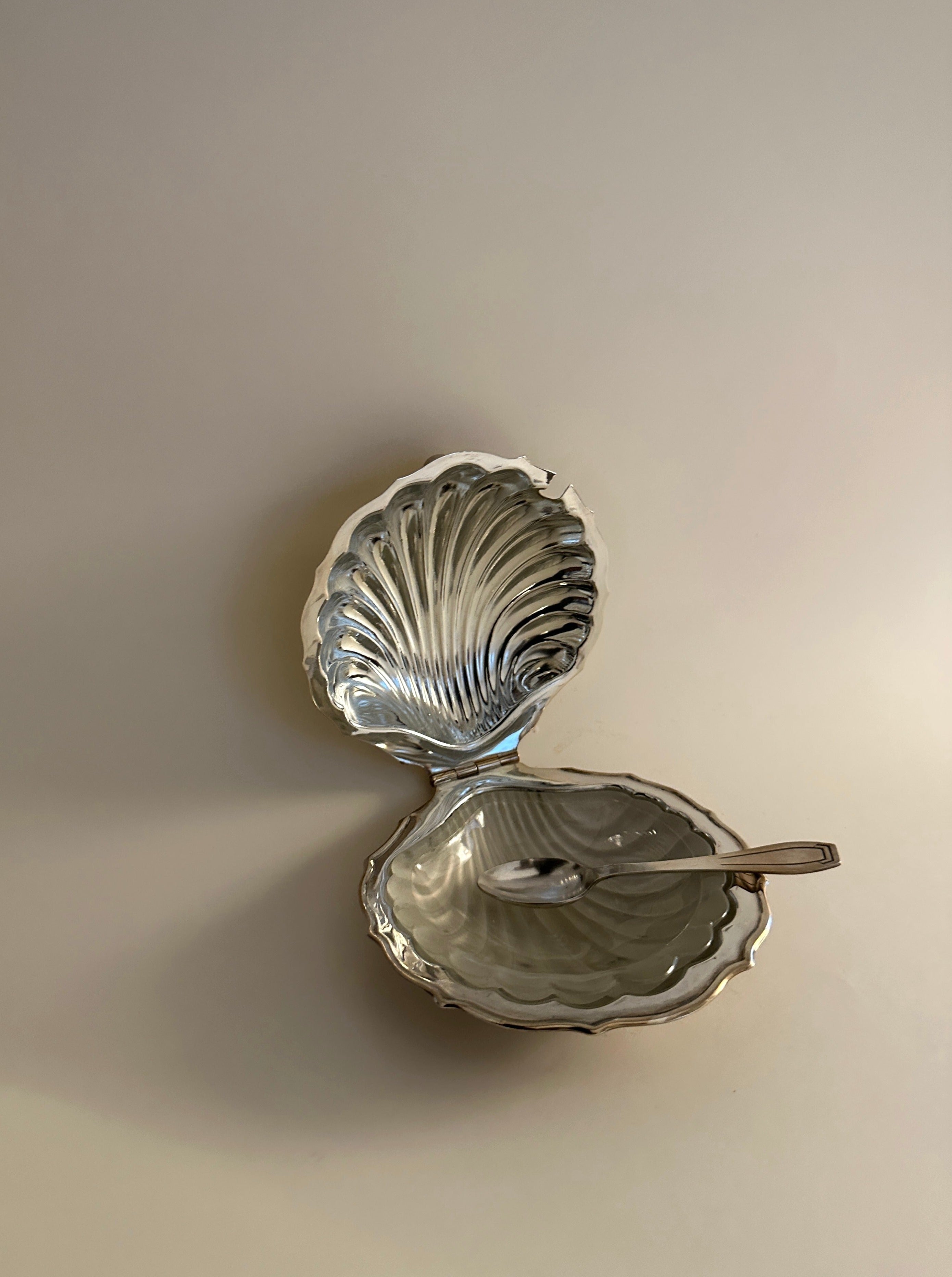 White ceramic shell shaped butter dish with lid and handle