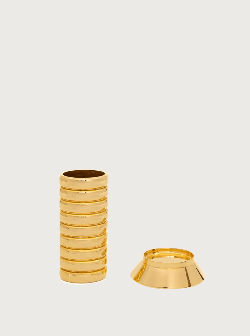 Gio Lighter Holder — close-up of polished gold metal texture