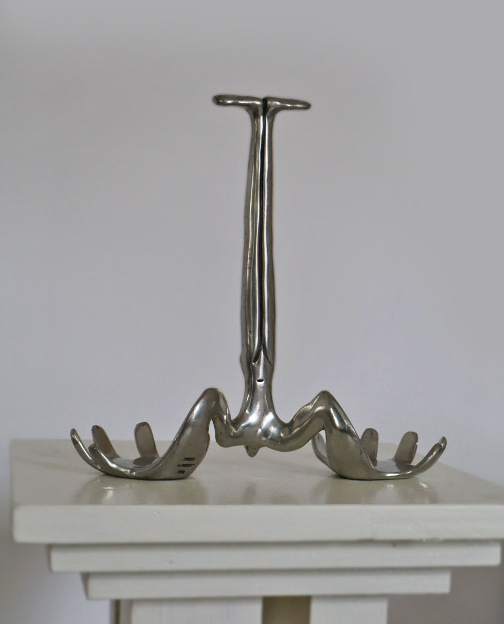 Carrol Boyes Sculptural Bottle Holder in Polished Metal by Porter Studio | The Oblist