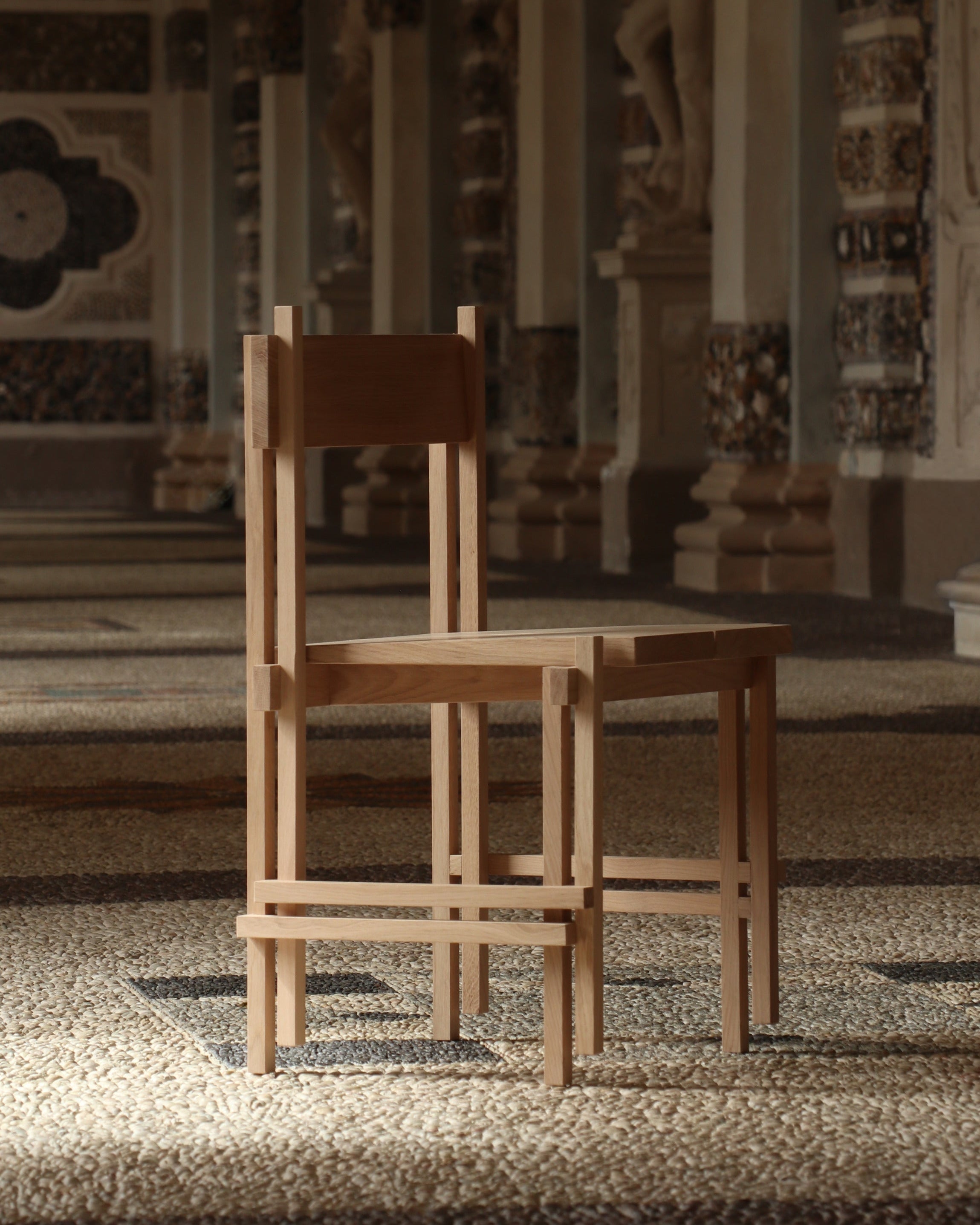 Modern wooden stackable chair with minimalist frame design by Filippo Andrighetto