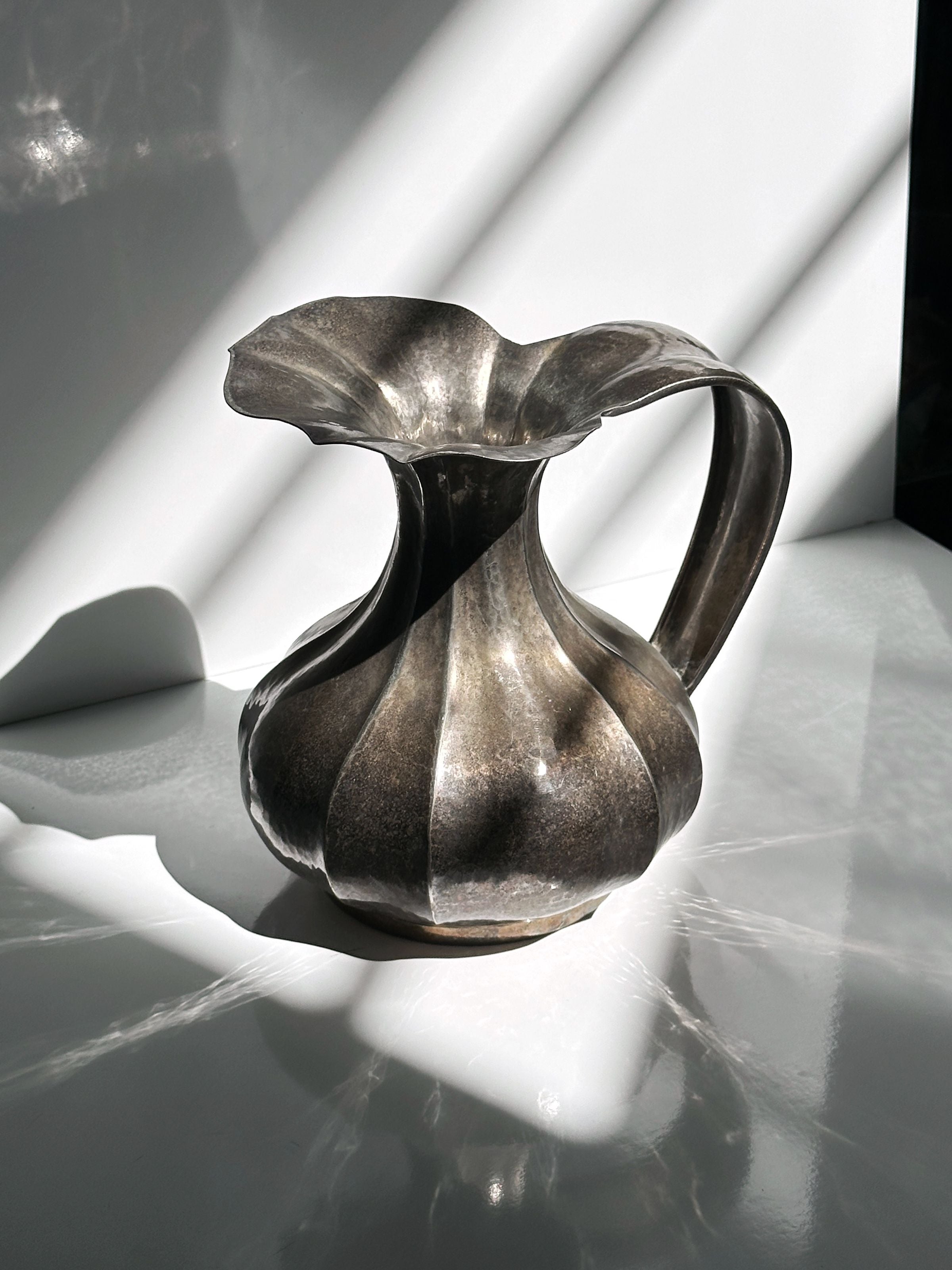 Silver-plated Art Nouveau metal vase with fluted body and handle