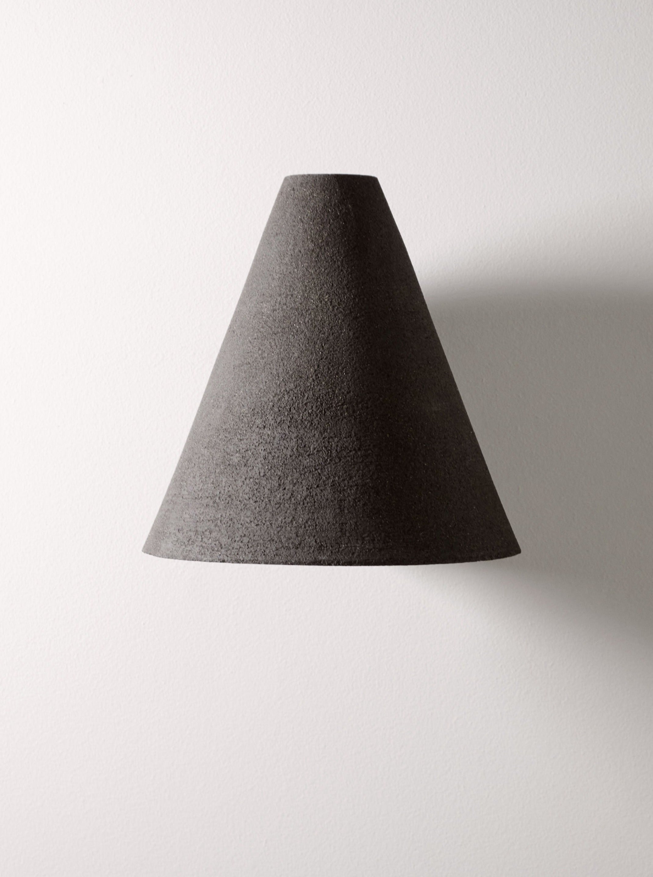 Esoteric black textured ceramic wall lamp shade by Mariza Galani