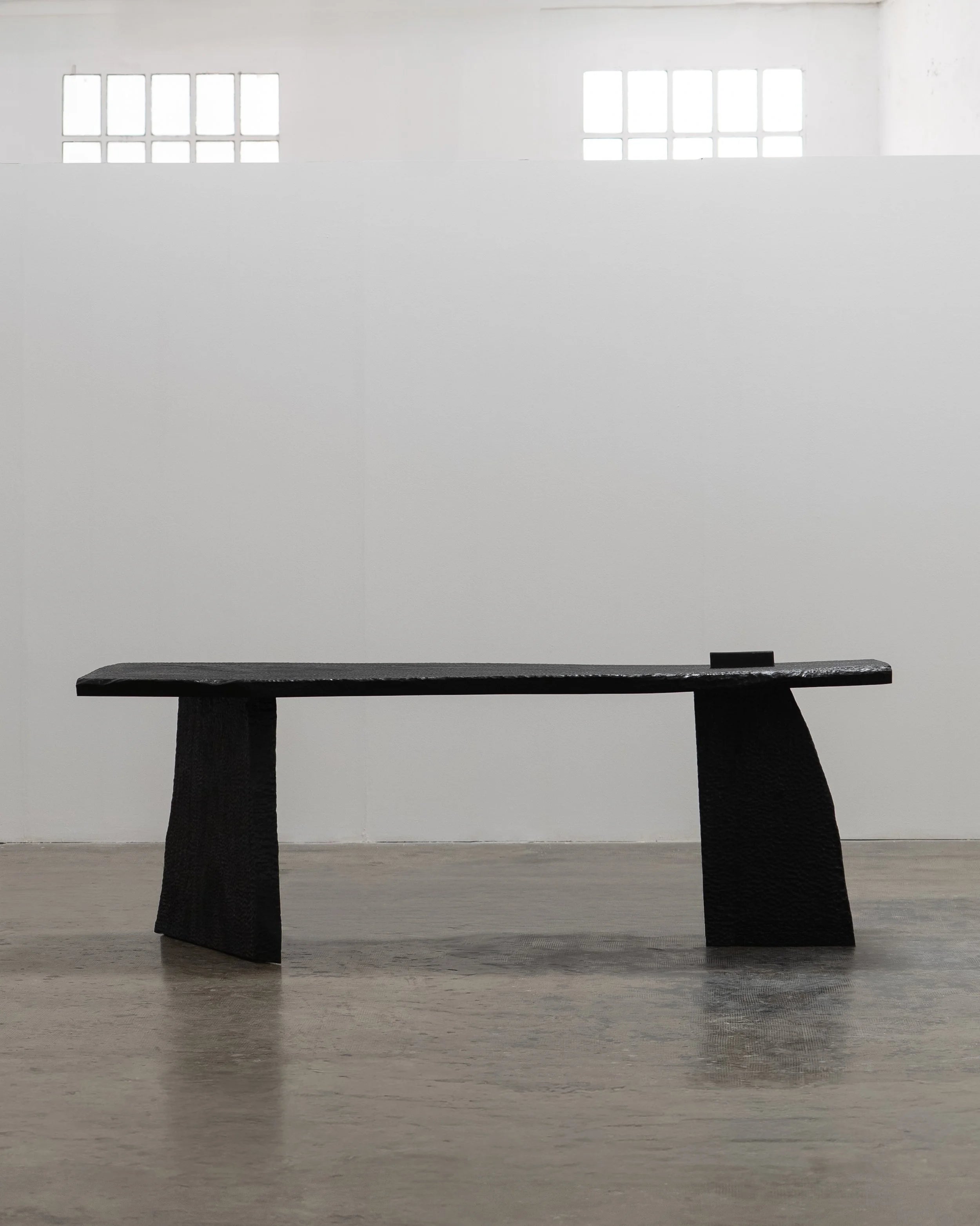 Massif Dining Table from Charred Eucalyptus Wood — side angle