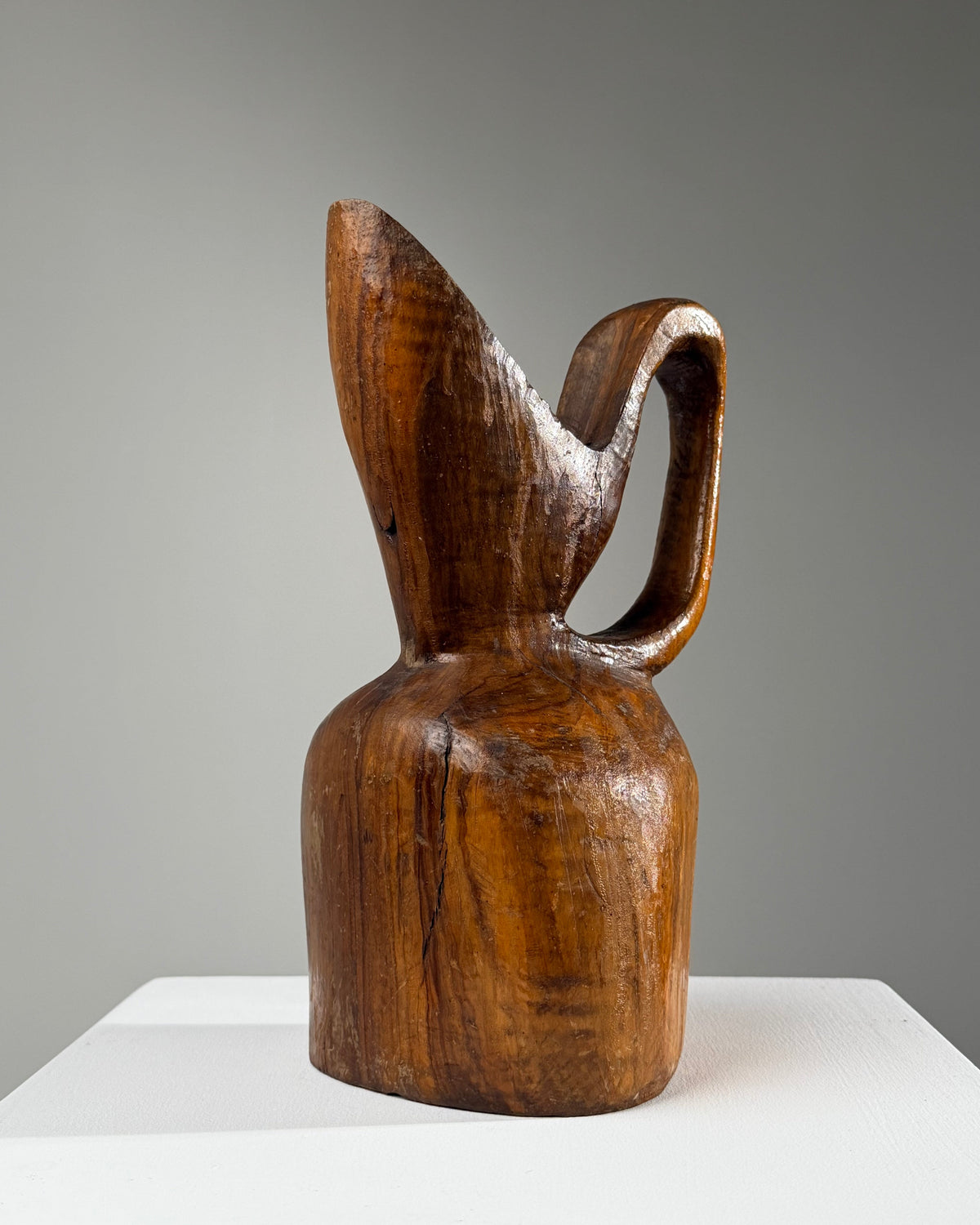 Carved olive wood pitcher, France, early 20th century. — detail view