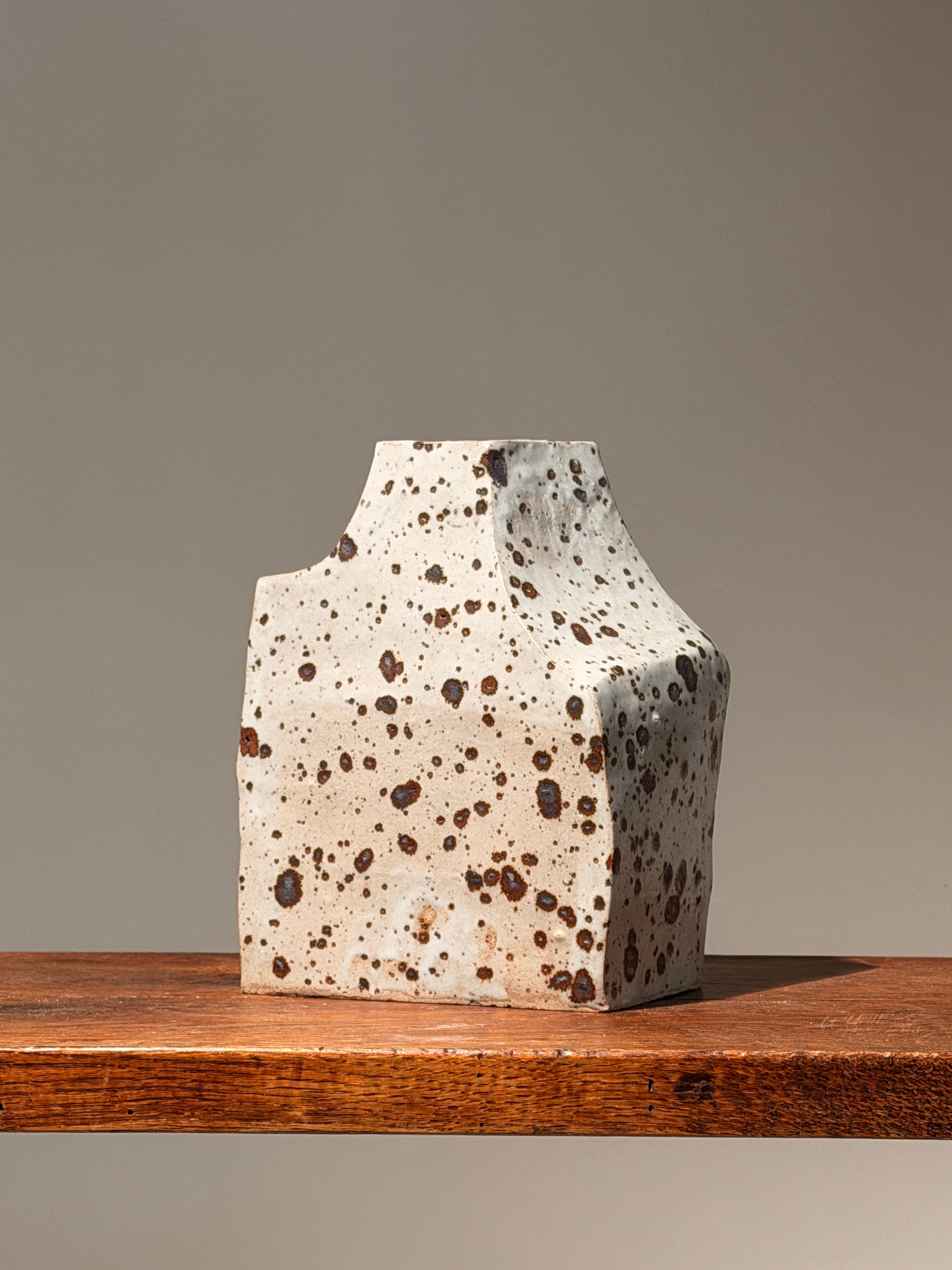 Geometric stoneware vase with pyrite glaze, France, circa 1960. — lifestyle setting