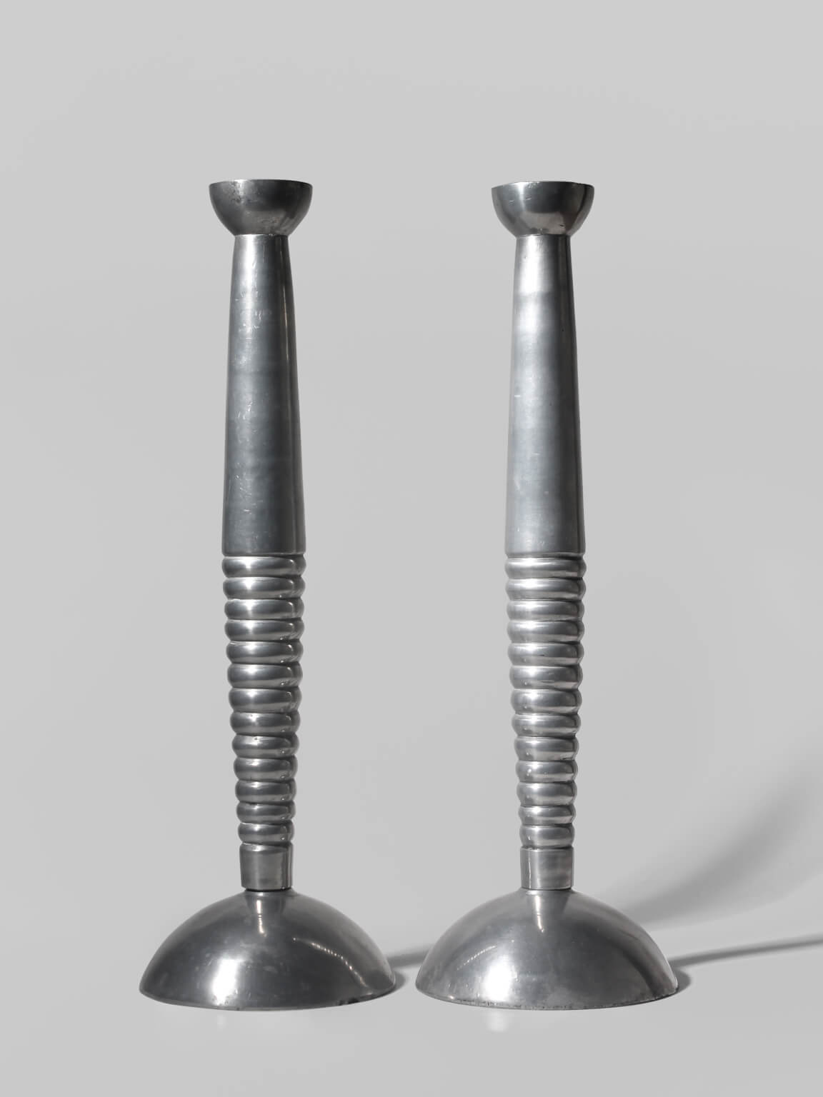 Pair Of Massive Rimmed Aluminum Candle Holders by Vintage Stories | The Oblist