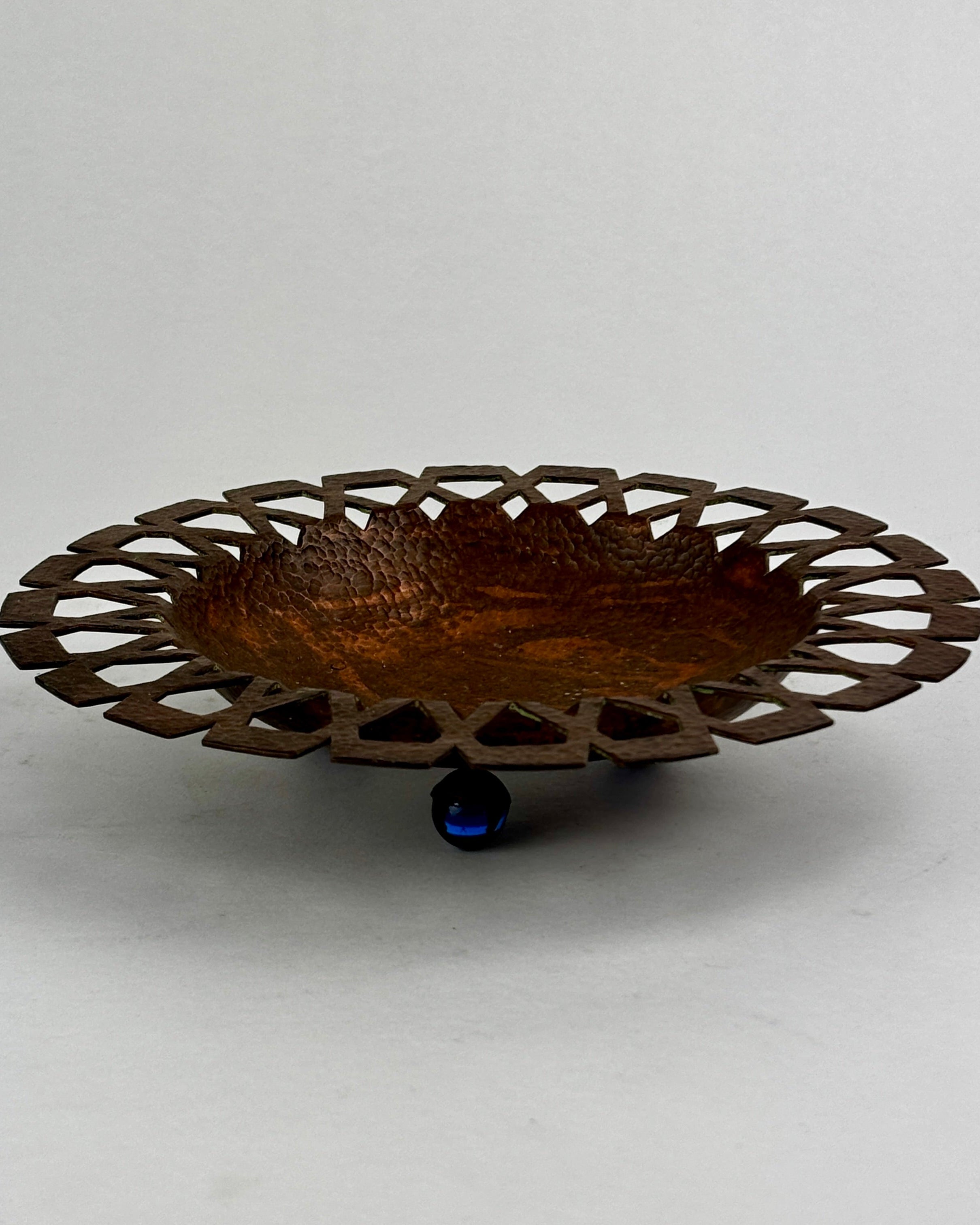 Hand hammered copper dish with decorative pierced rim edge