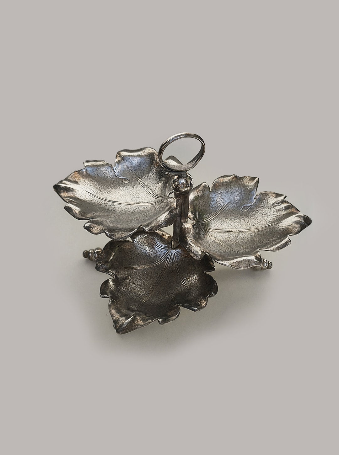Silver-plated triple leaf serving tray with ornate handle
