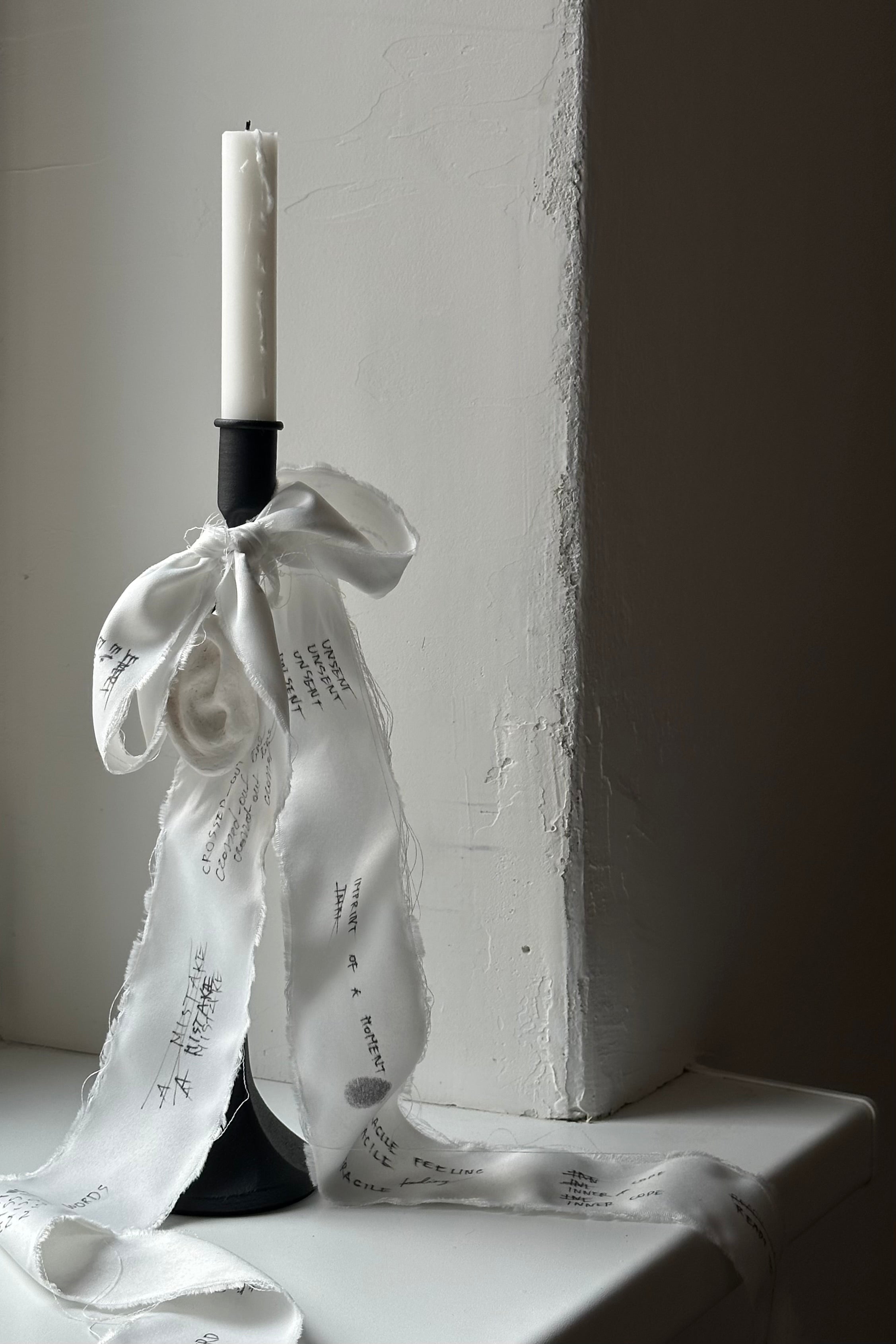 'UNSENT EAR' candleholder — lifestyle setting