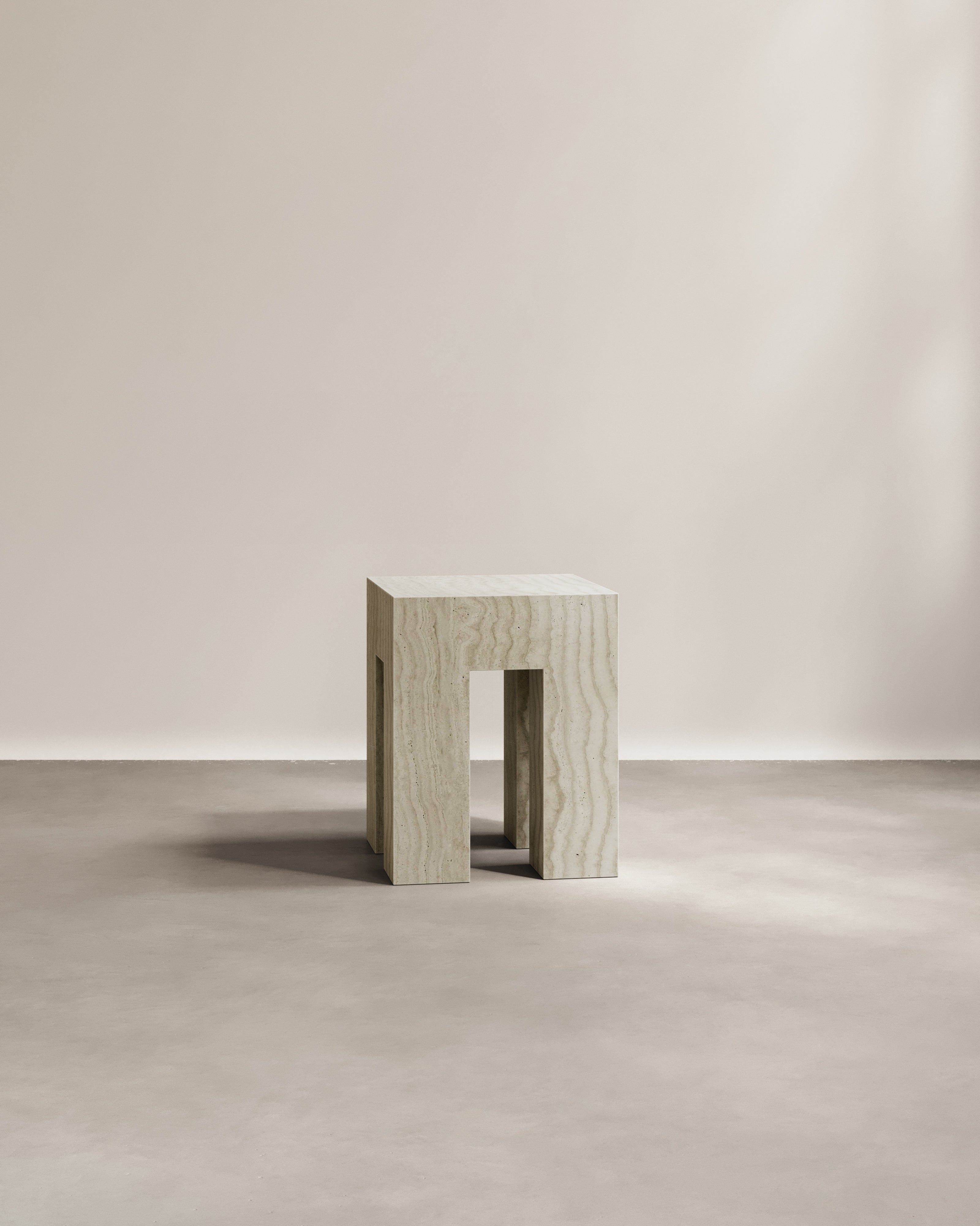 Travertine Altar side table by Paloma Editions front view