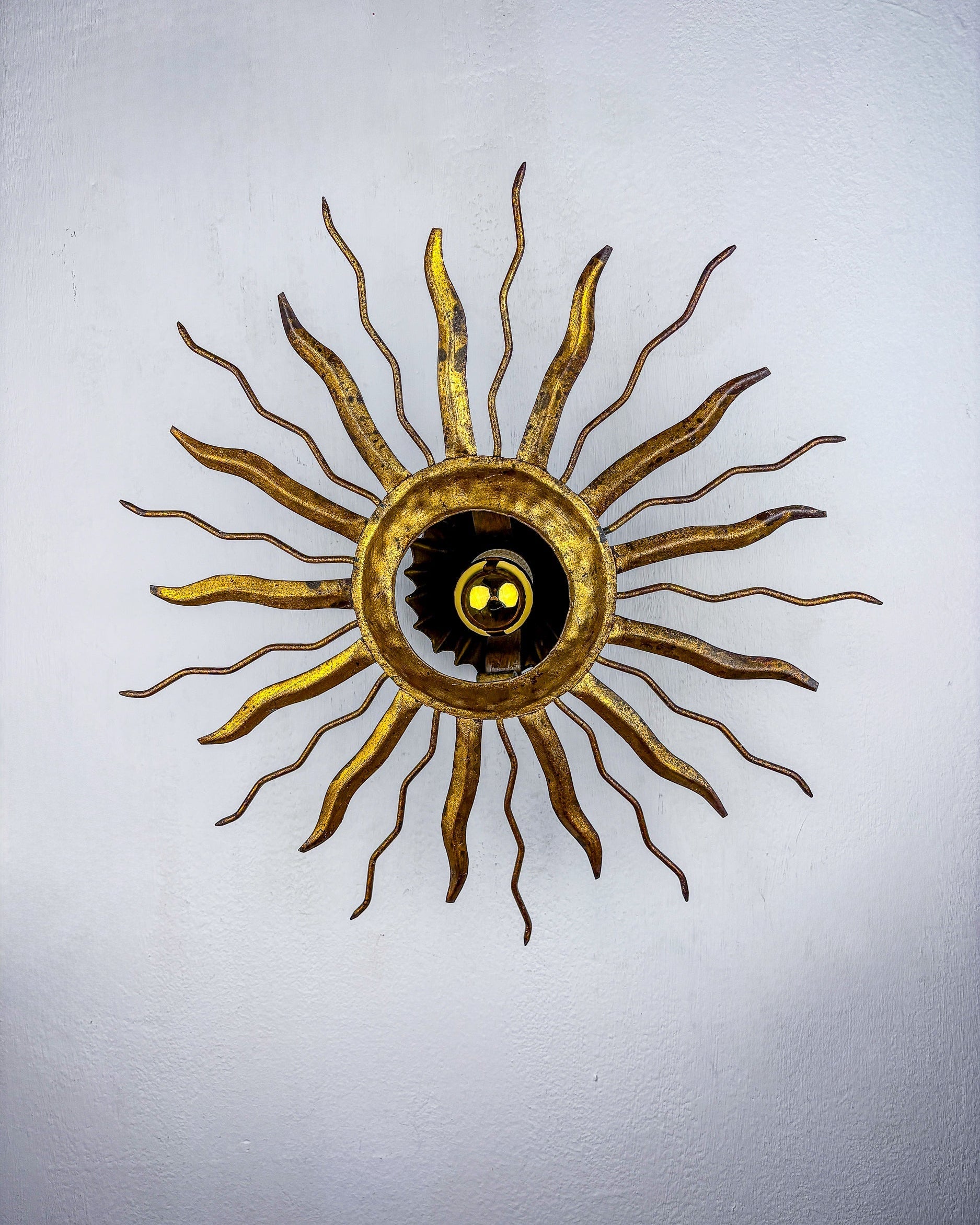 Brutalist Sunburst Ceiling Light – Gilt Iron Rays & Exposed Bulb, France, 1960s by Malamar Studio | The Oblist