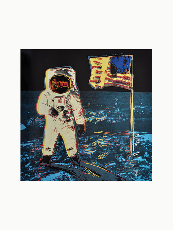 An astronaut in a stylized suit stands on a rocky surface holding a flagpole with a fluttering flag, depicted in vibrant, pop art colors against a dark background in Maison Plage's The Andy Warhol Foundation for the Visual Arts: 20 Year Report 1987-2007.