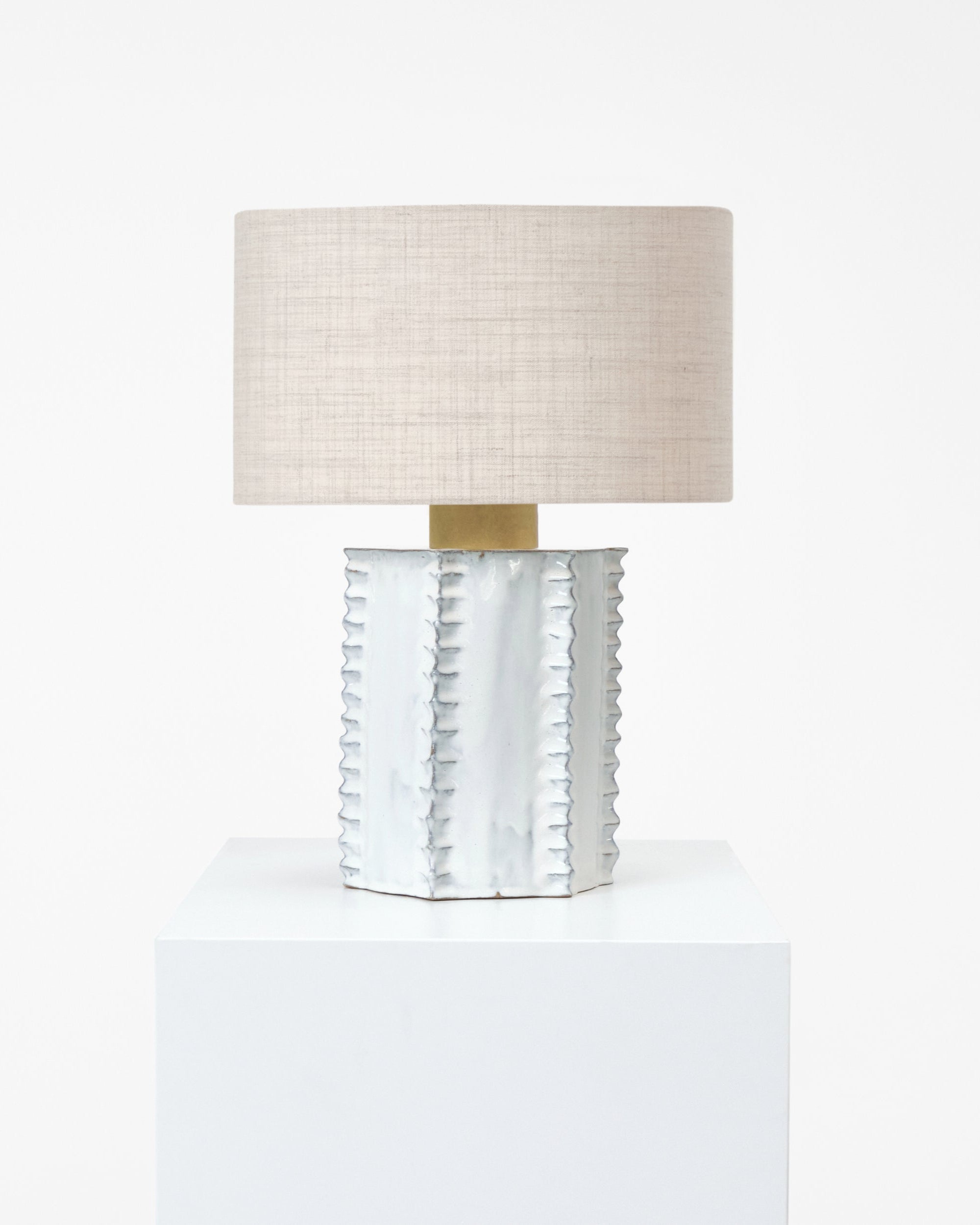 Totem Table Light — close-up of white ceramic base with linen shade