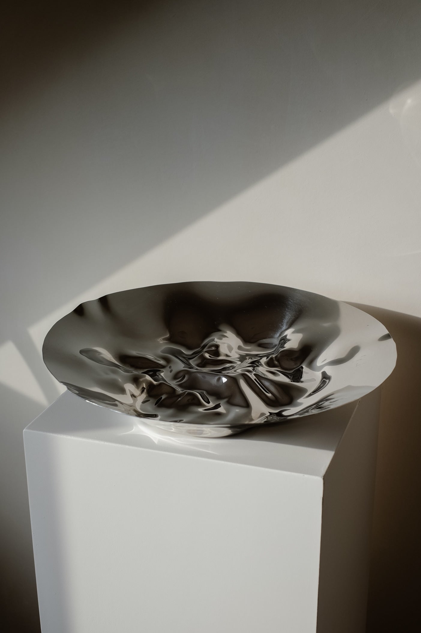 Chrome Curved Decorative Bowl by septembre studios | The Oblist — polished metal finish
