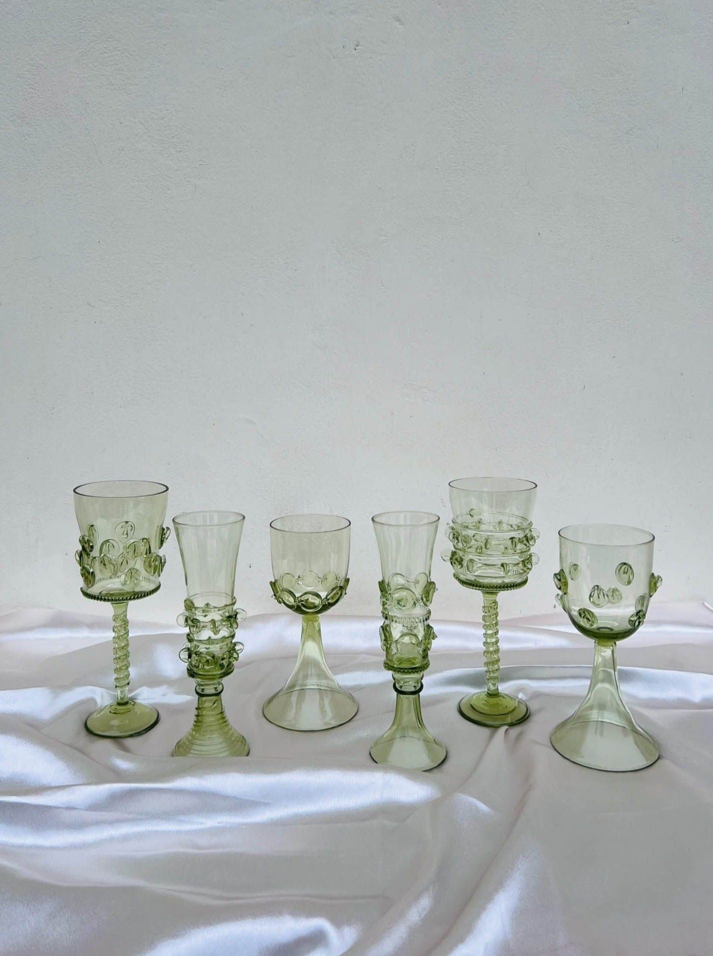 Set of six Mouthblown Wine Glasses — close-up of green glass textures
