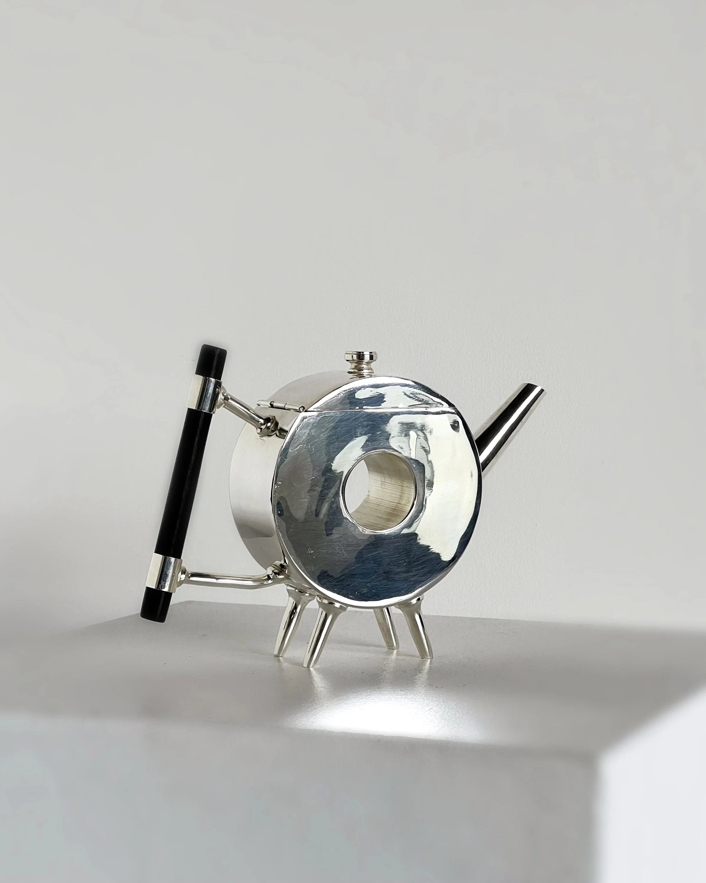 Christopher Dresser ornate circular teapot by Porter Studio | The Oblist — polished metal, modern design
