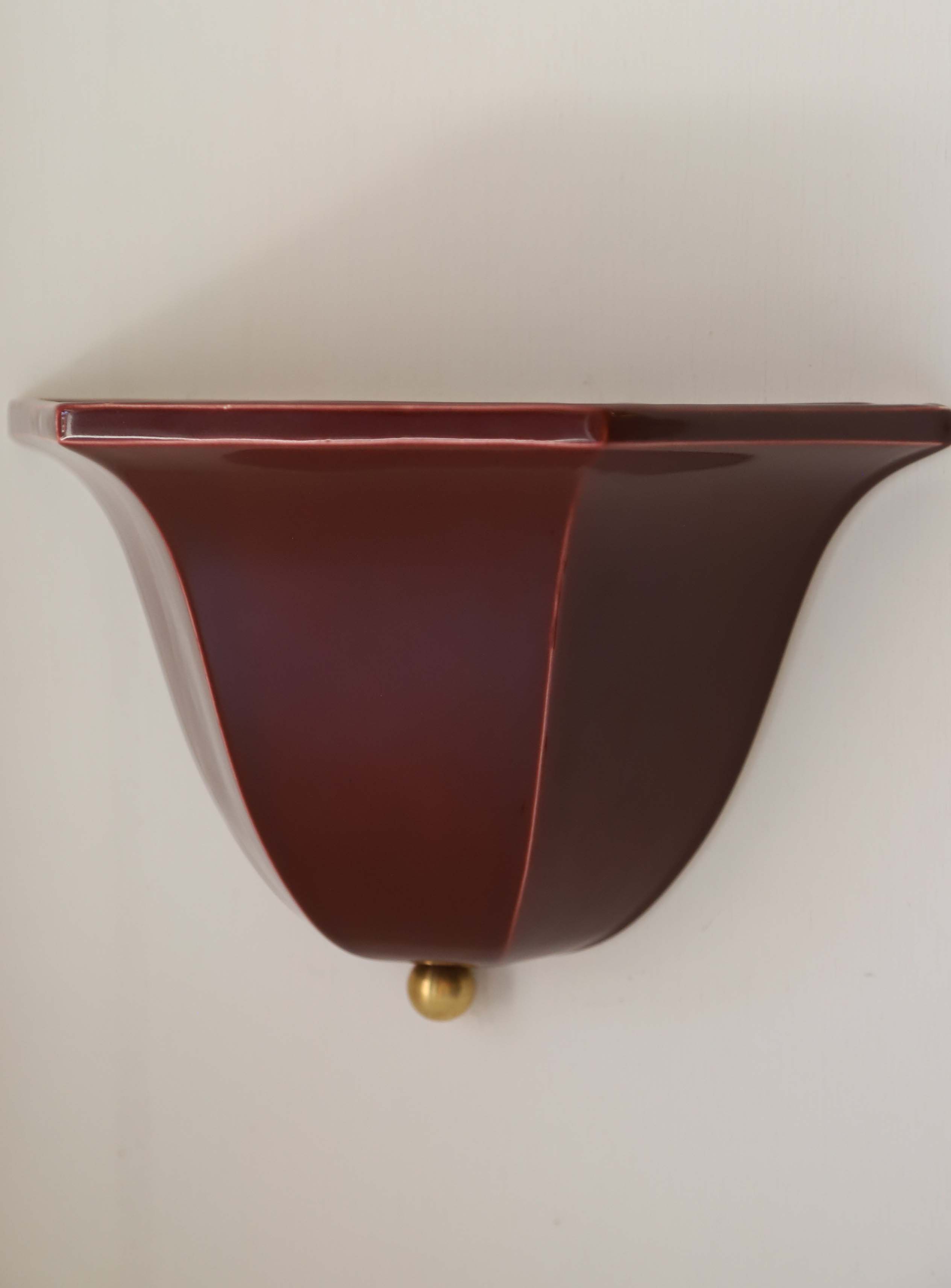 Maeve burgundy glass wall sconce with brass accent detail