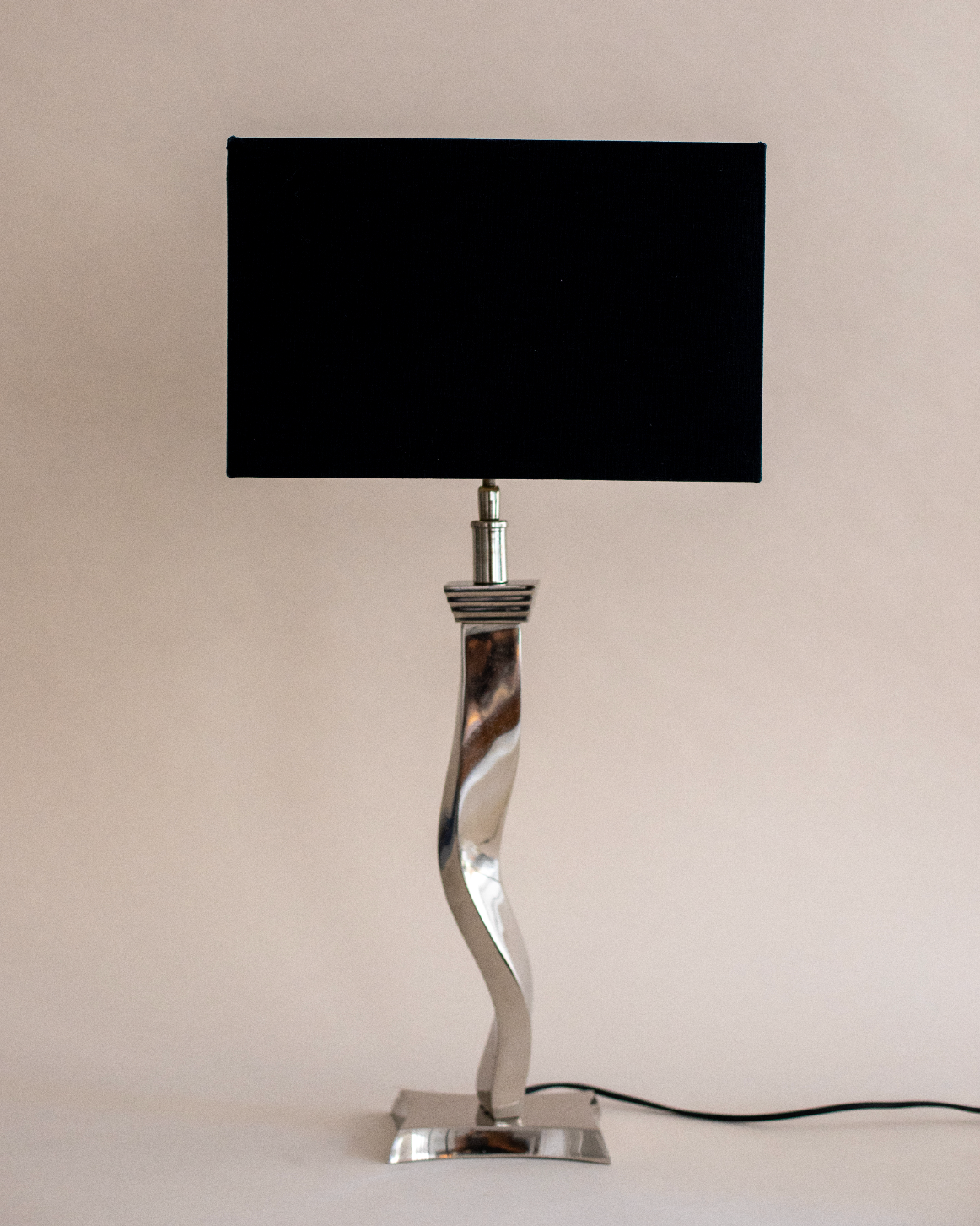 Tavira polished chrome twisted base table lamp with black shade