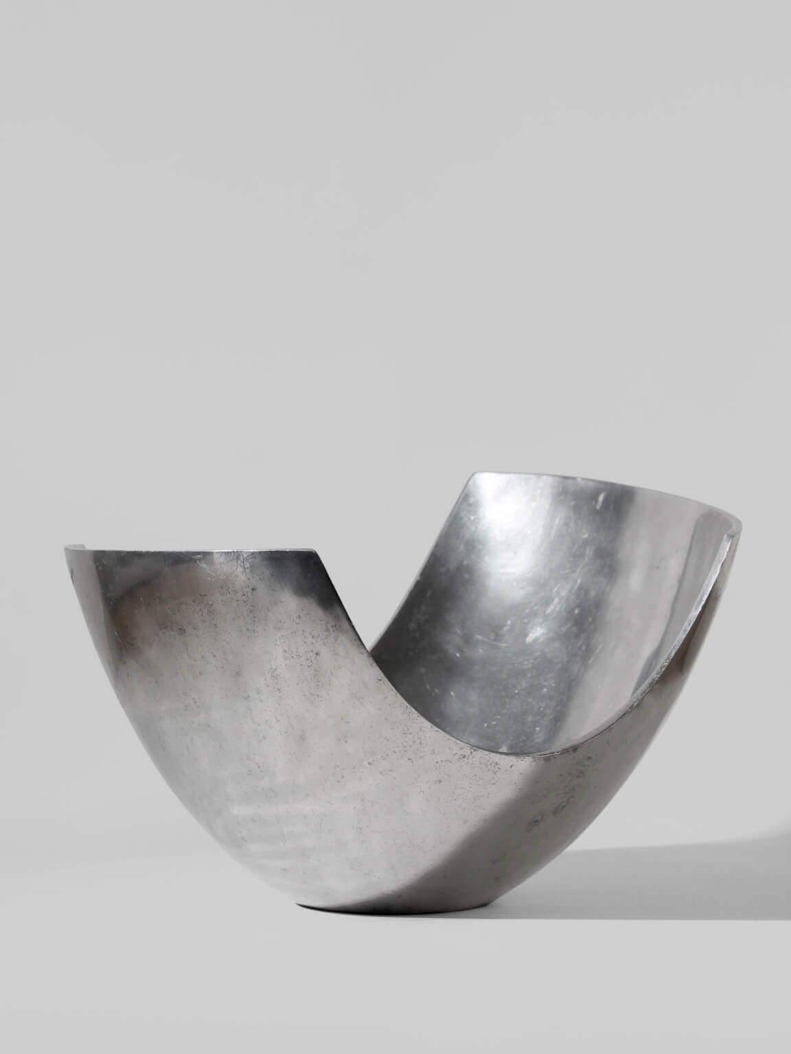 Polished Aluminum Asymmetric Contemporary Large Deep Bowl by Vintage Stories | The Oblist — polished silver finish