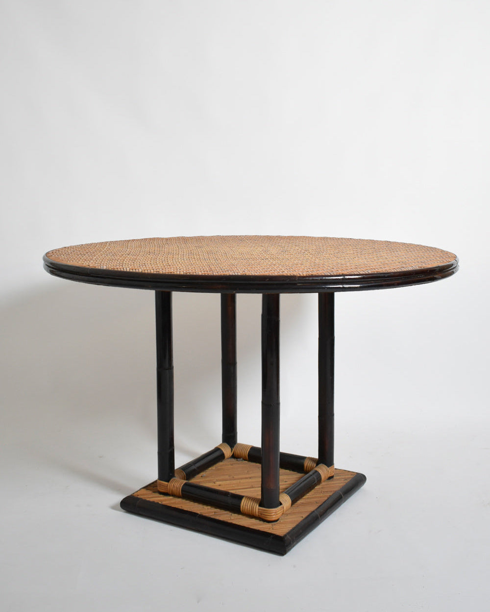 Bicolor round rattan dining table by Barracuda Interiors | The Oblist