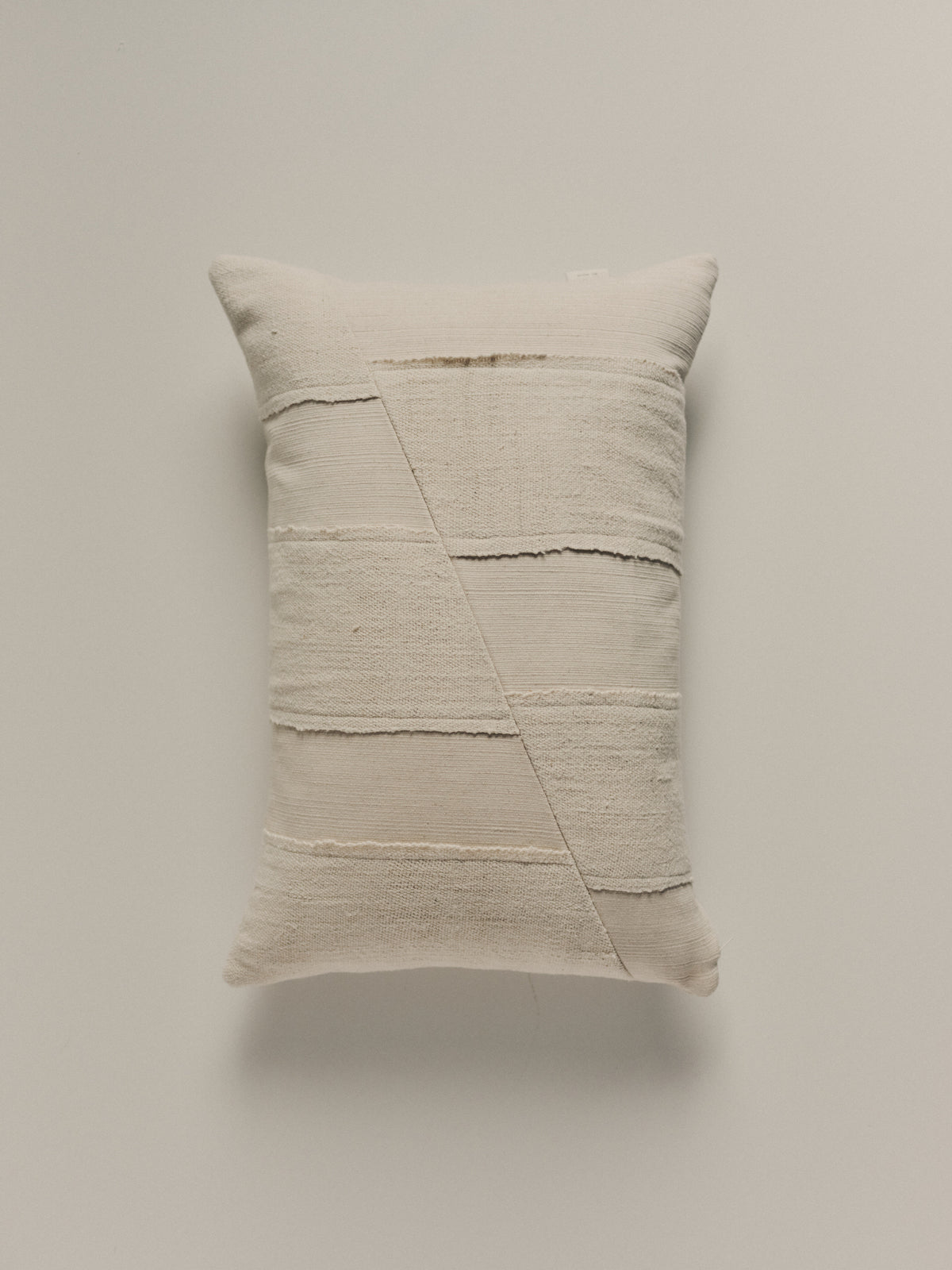 Handwoven white cushion in cotton and hemp by Elle La | The Oblist