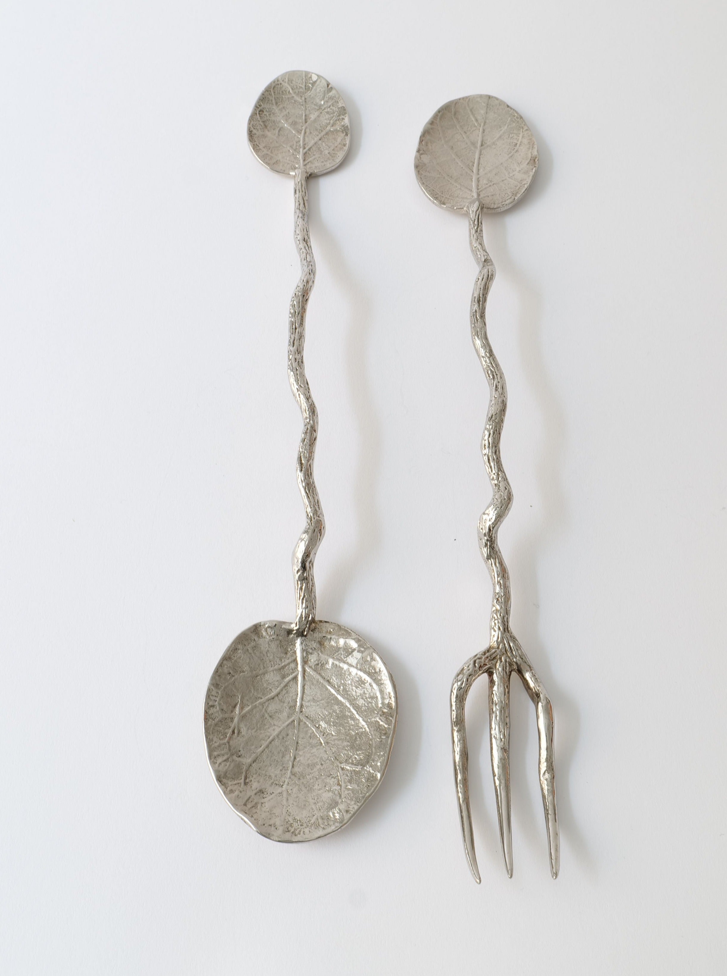 Set of elegant stainless steel serving utensils for stylish dining