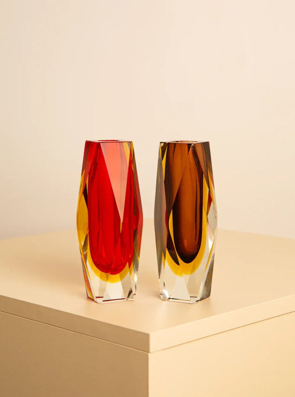 Pair of vibrant red and amber Diamant vases by Flavio Poli for Mandruzzato, showcasing intricate diamond-shaped patterns and elegant craftsmanship