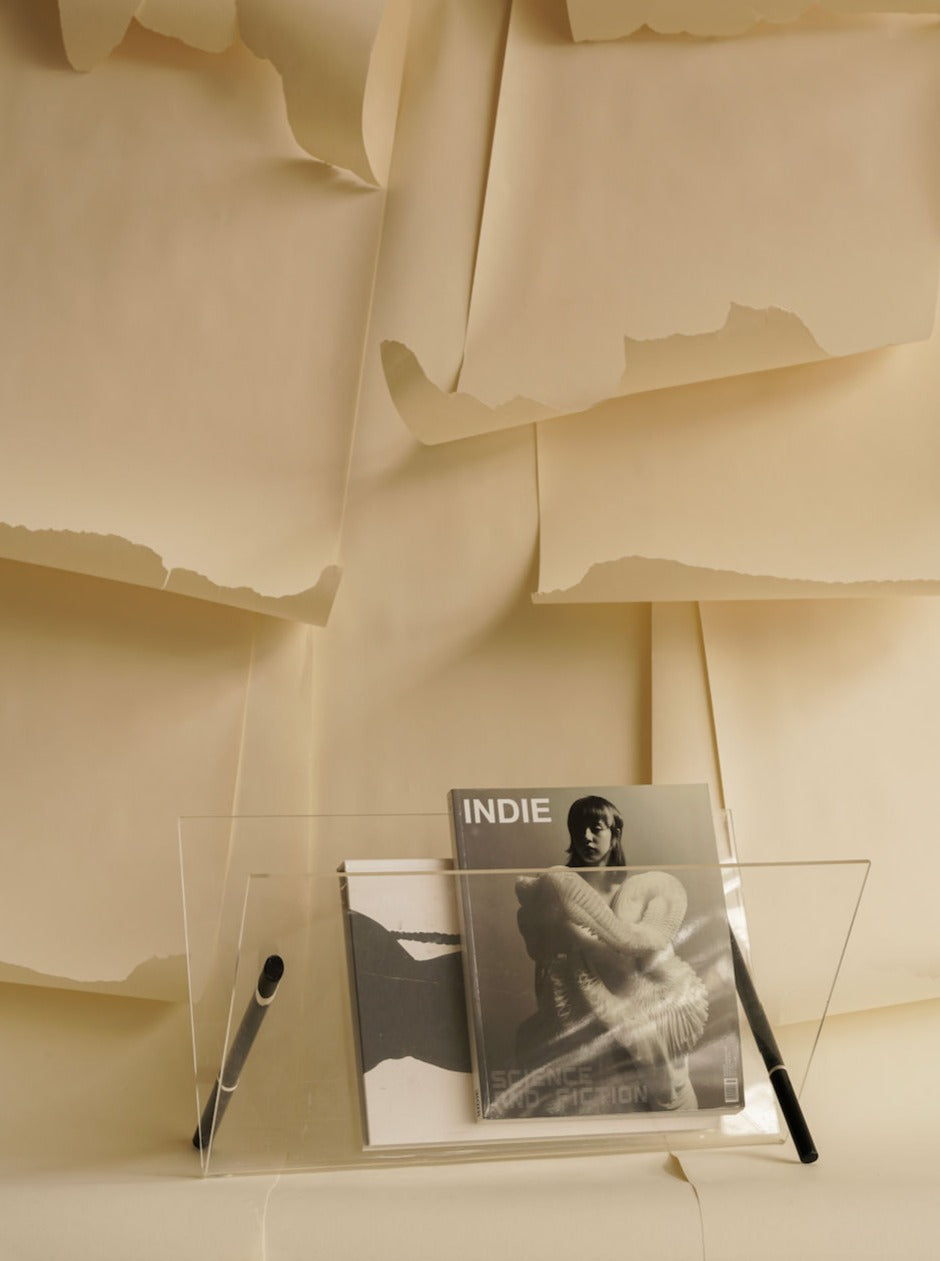 Modern black metal magazine rack with geometric design and 3 compartments