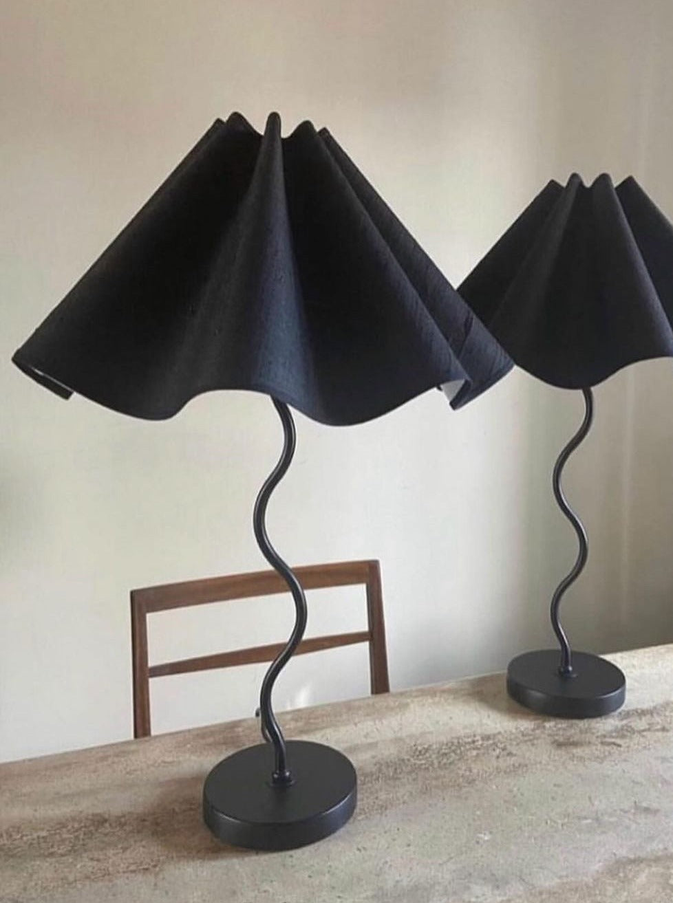 The Maud Vaughan Wiggle Lamp in sleek black metal with adjustable arm and dome shade, perfect for modern home office or study room decor