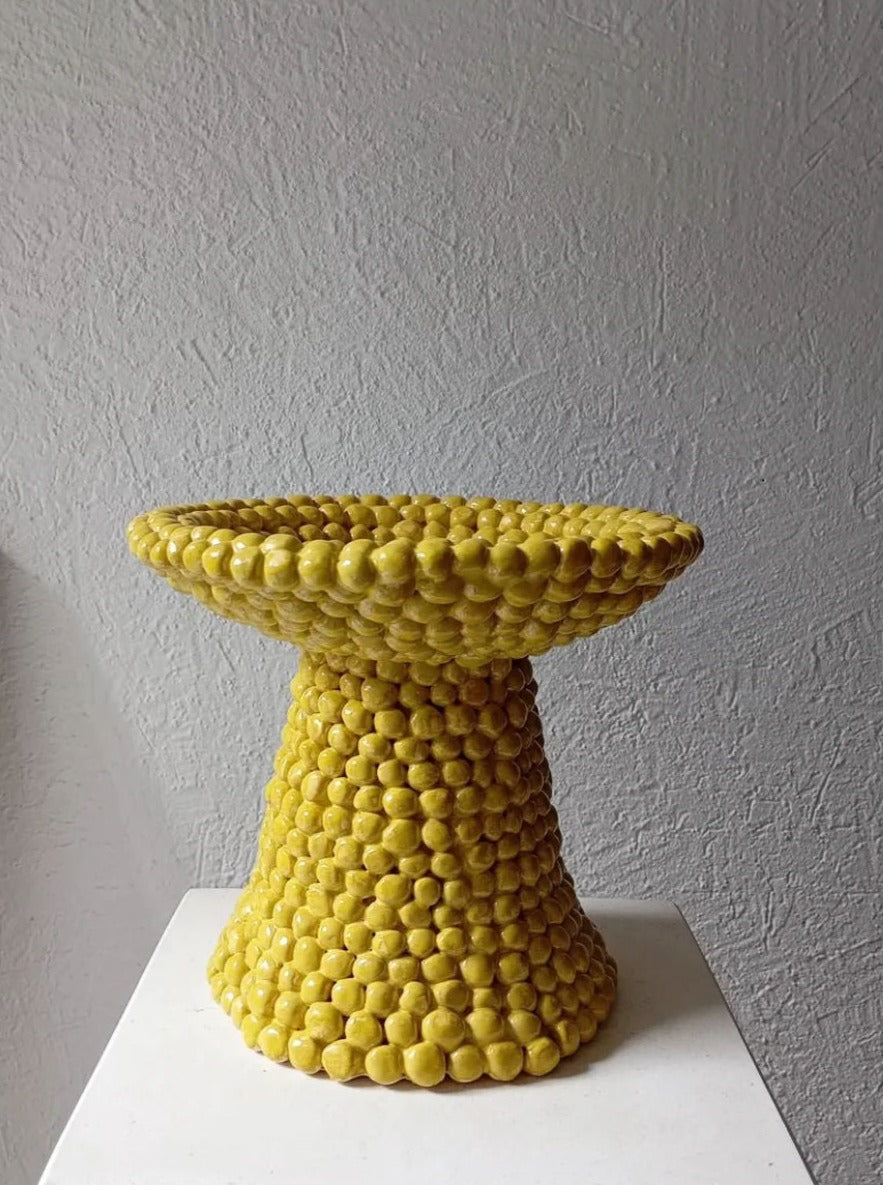 Handcrafted yellow stoneware bowl with matte finish and organic shape