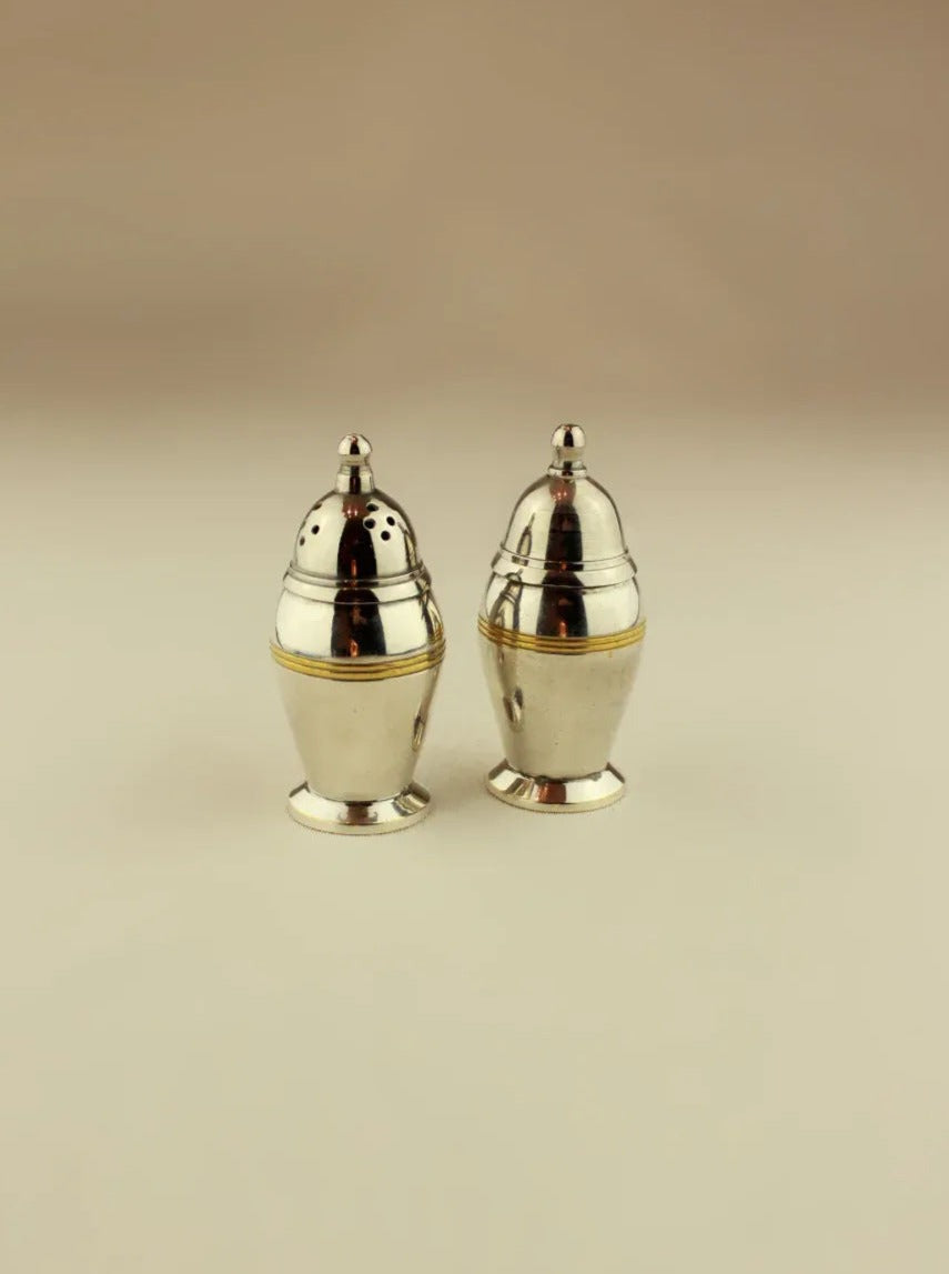 Art Deco Salt and Pepper shakers in silver and black marble, elegant design with geometric patterns, perfect tabletop accessories for stylish dining