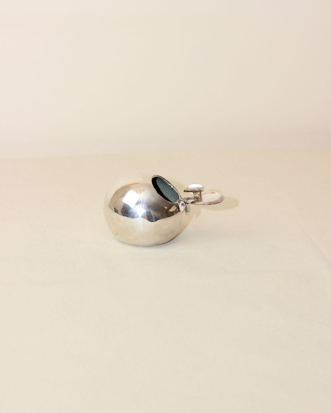 Polished chrome space age ashtray with hinged lid and handle