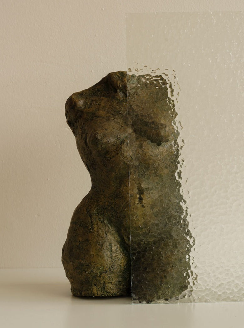 Beautifully crafted women torso sculpture in white marble with intricate detailing and elegant curves