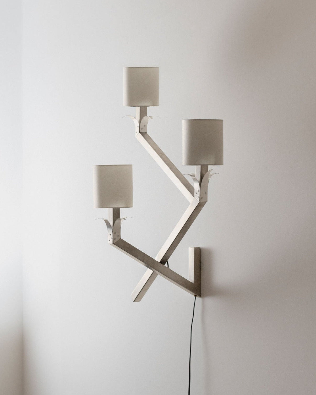 Stainless Wall Lamp 04 illuminating outdoor patio space with warm glow