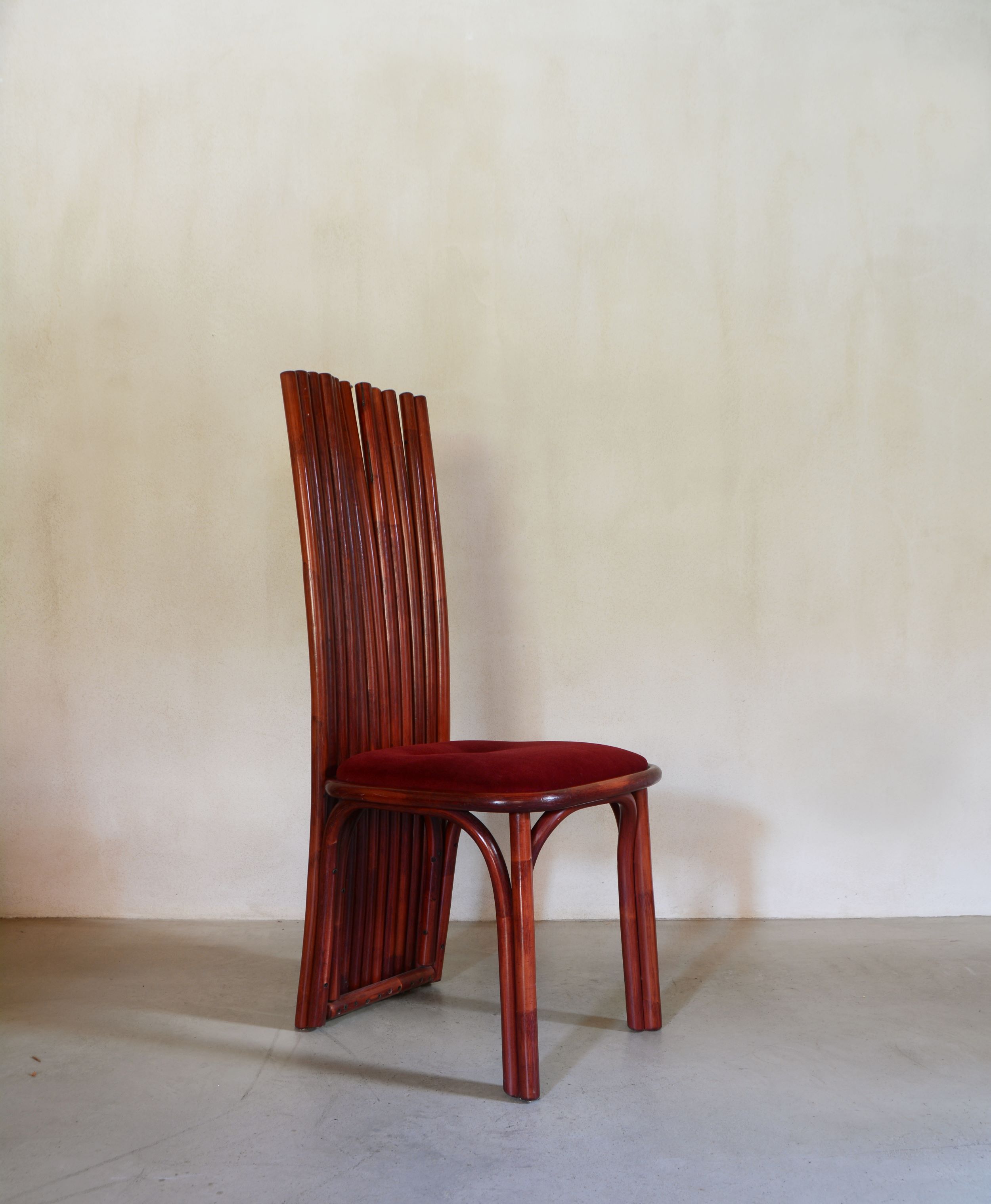 Red rattan dining chair with high vertical slat backrest, 1970s