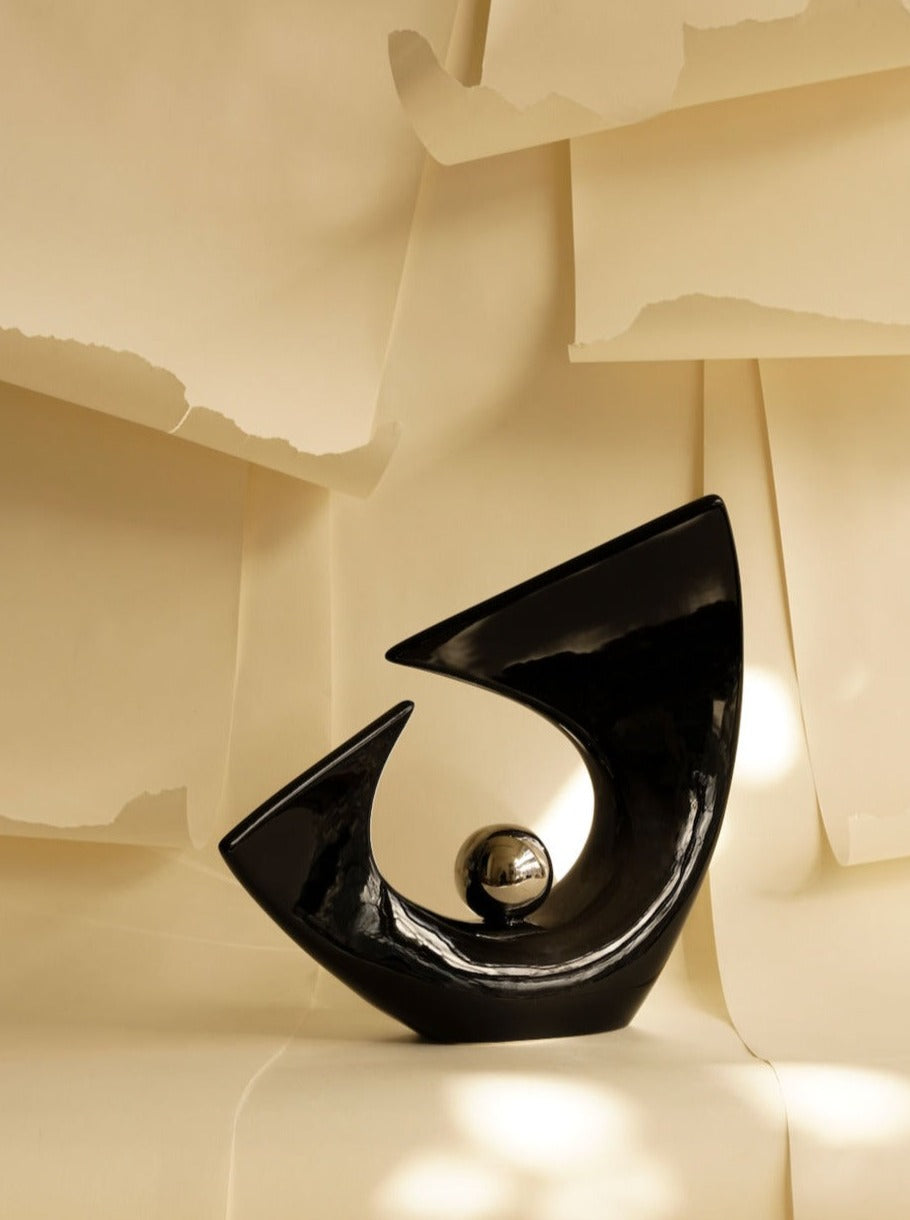 Abstract metal sculpture with clean lines and geometric shapes in modernist style