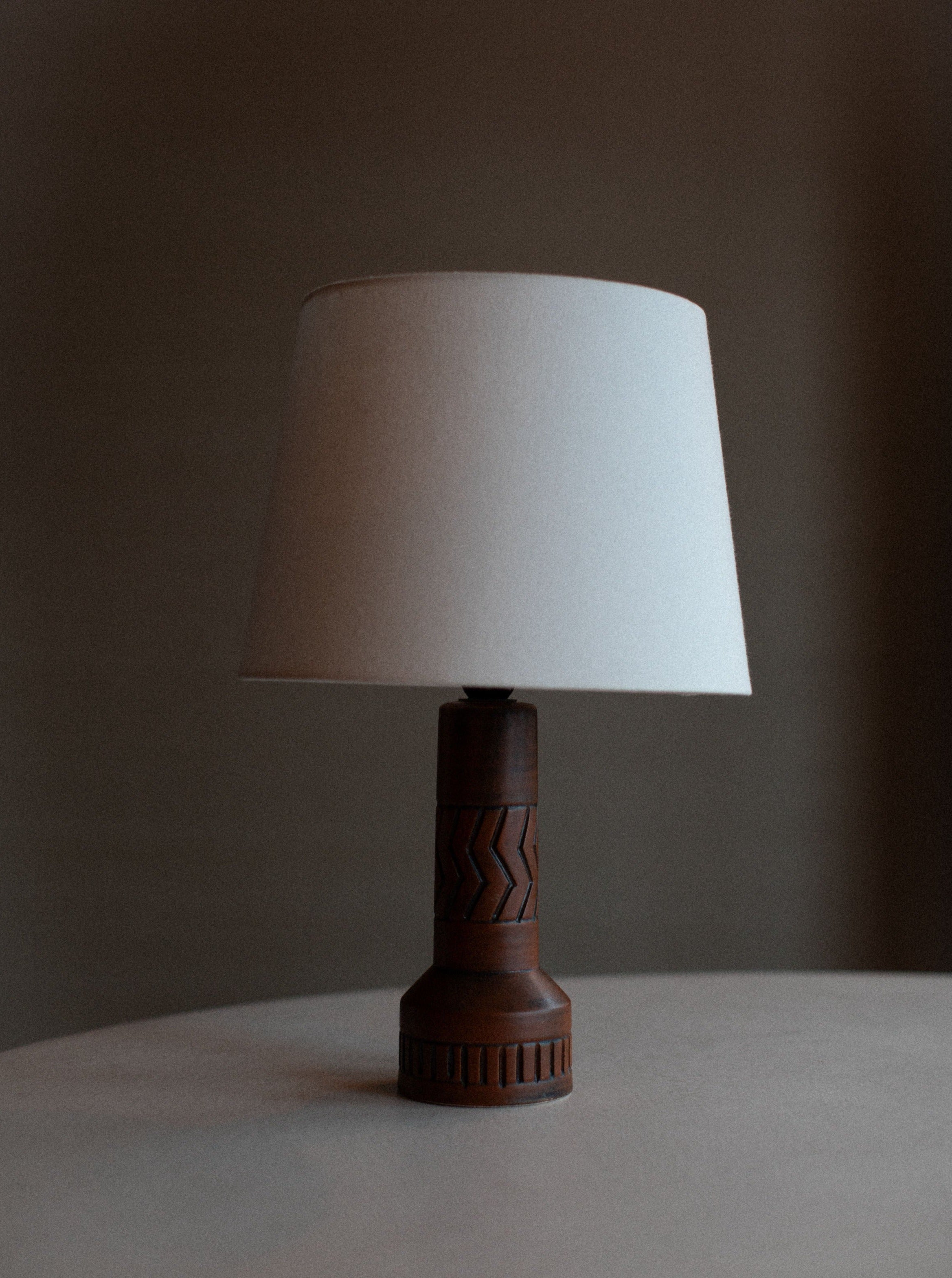 Vintage stoneware lamp with floral design on ceramic base