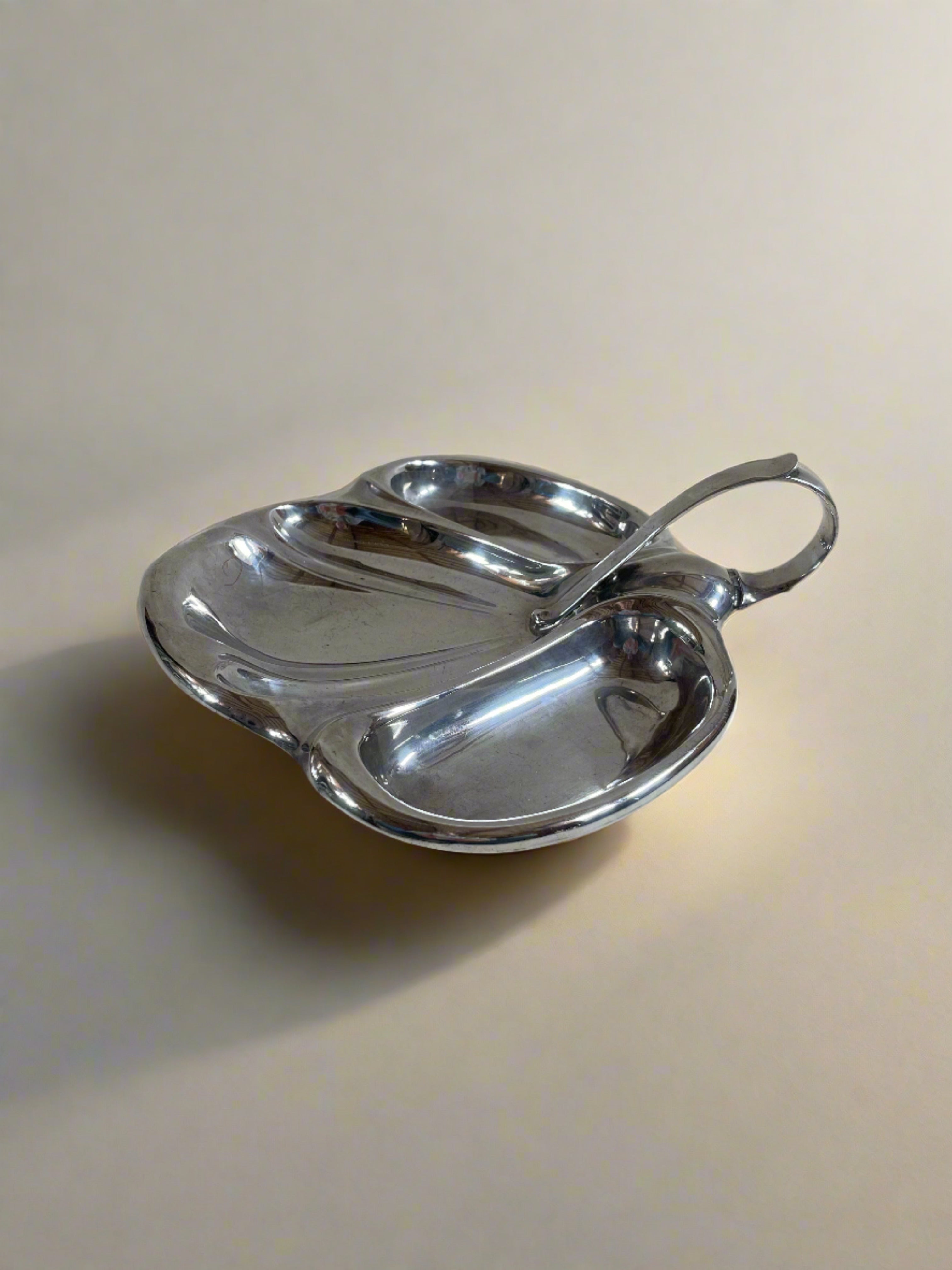 A Vintage Mappin and Webb Silver Plate Serving Dish by Maud Vaughan features three elongated oval compartments and a curved handle, set against a neutral background. Crafted by renowned British silversmiths, its elegant design marries functionality with timeless style.