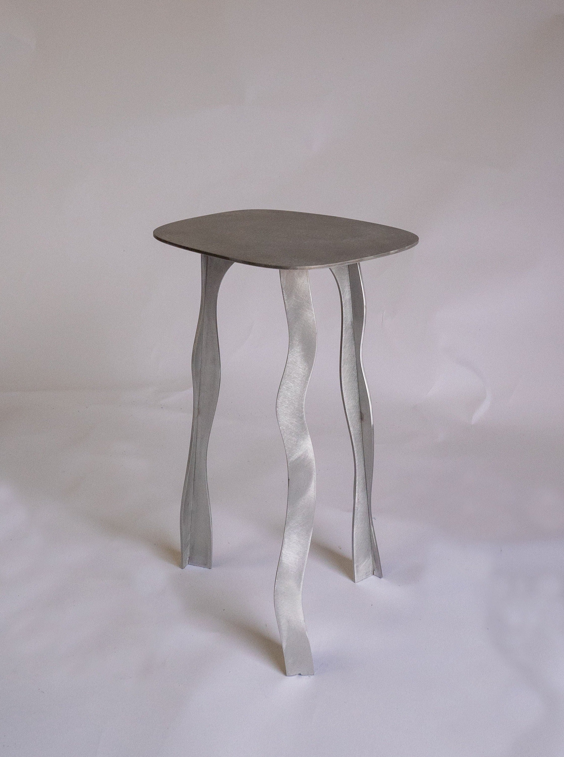 Stool 02 in solid oak with minimalist design and curved seat