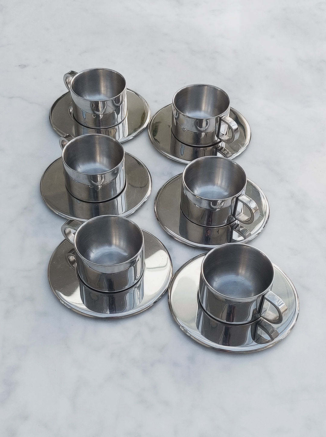 Set of 6 white porcelain espresso cups with matching saucers